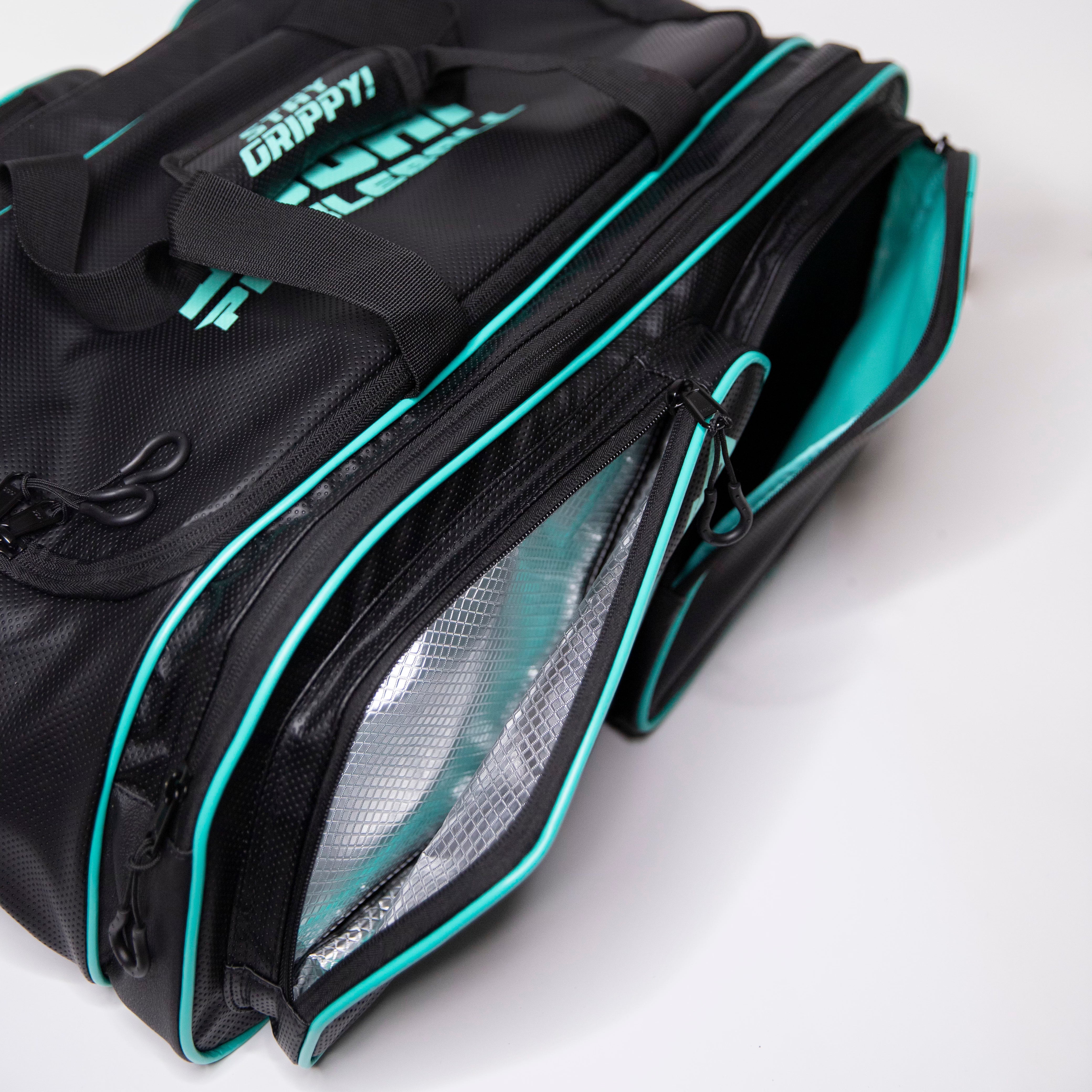 A black and turquoise fishing bag with an open insulated compartment.