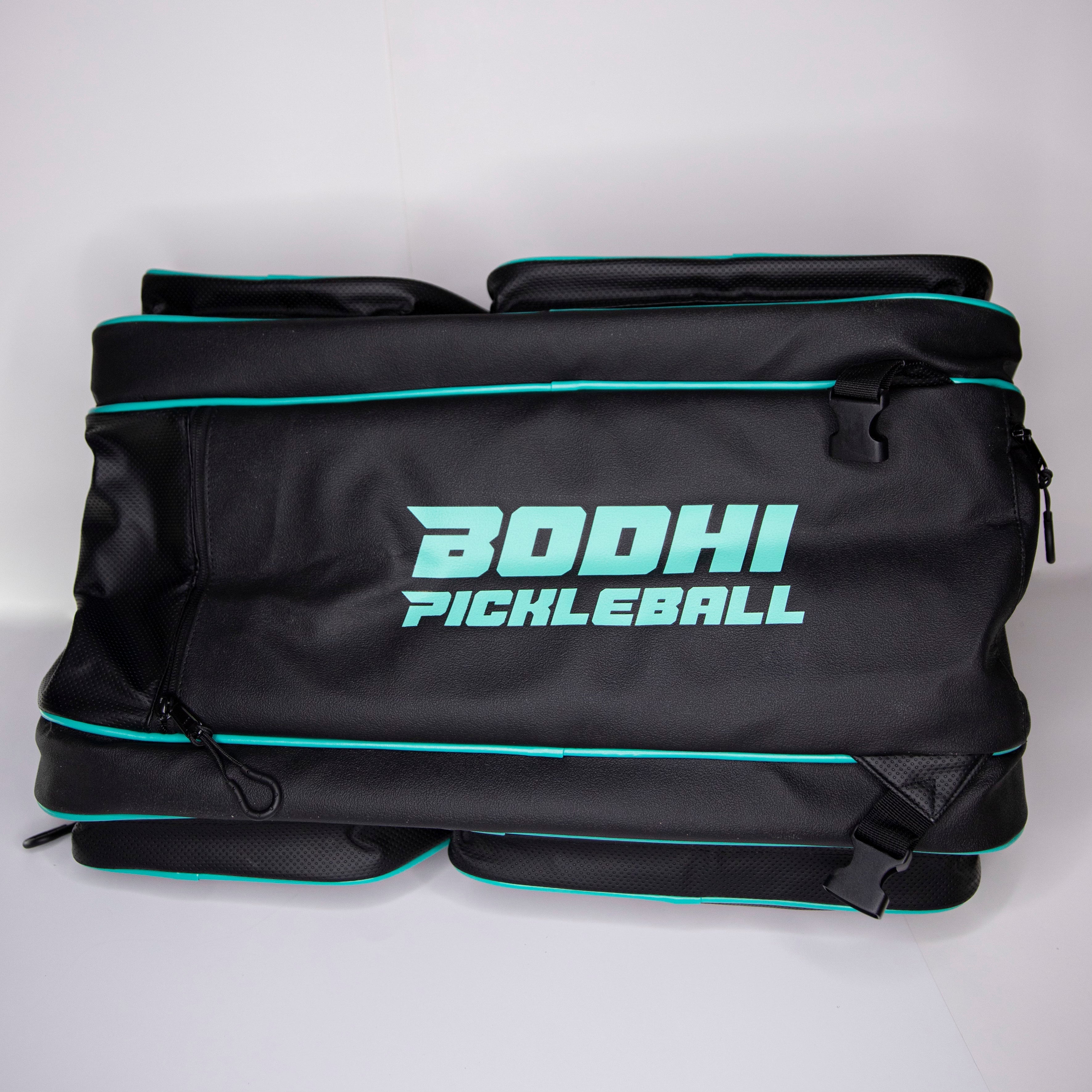 Black pickleball bag with teal accents.