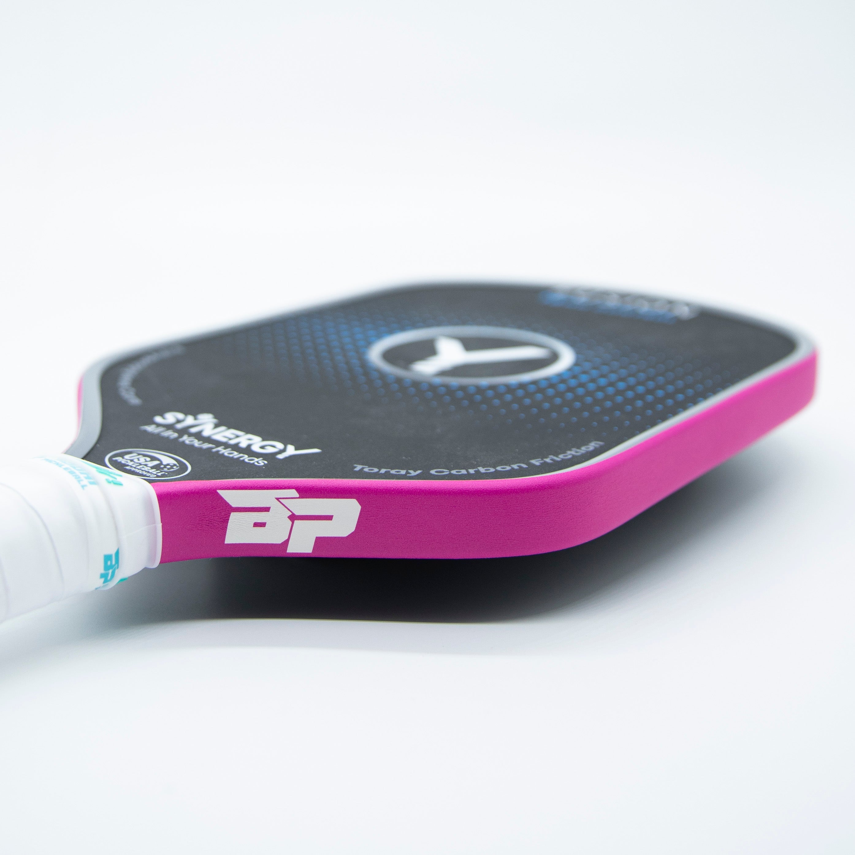 A pink and black pickleball paddle.
