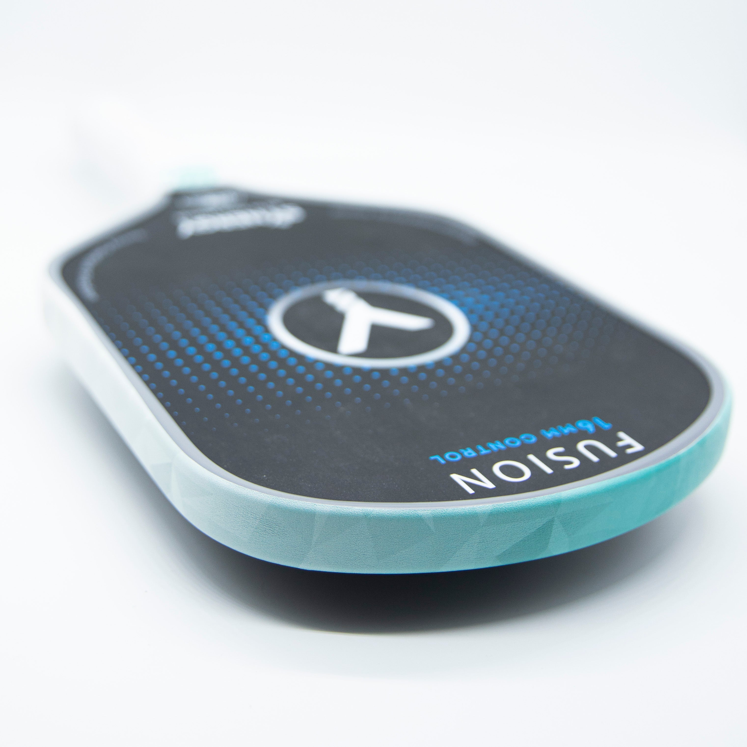 A pickleball paddle with a turquoise rim.