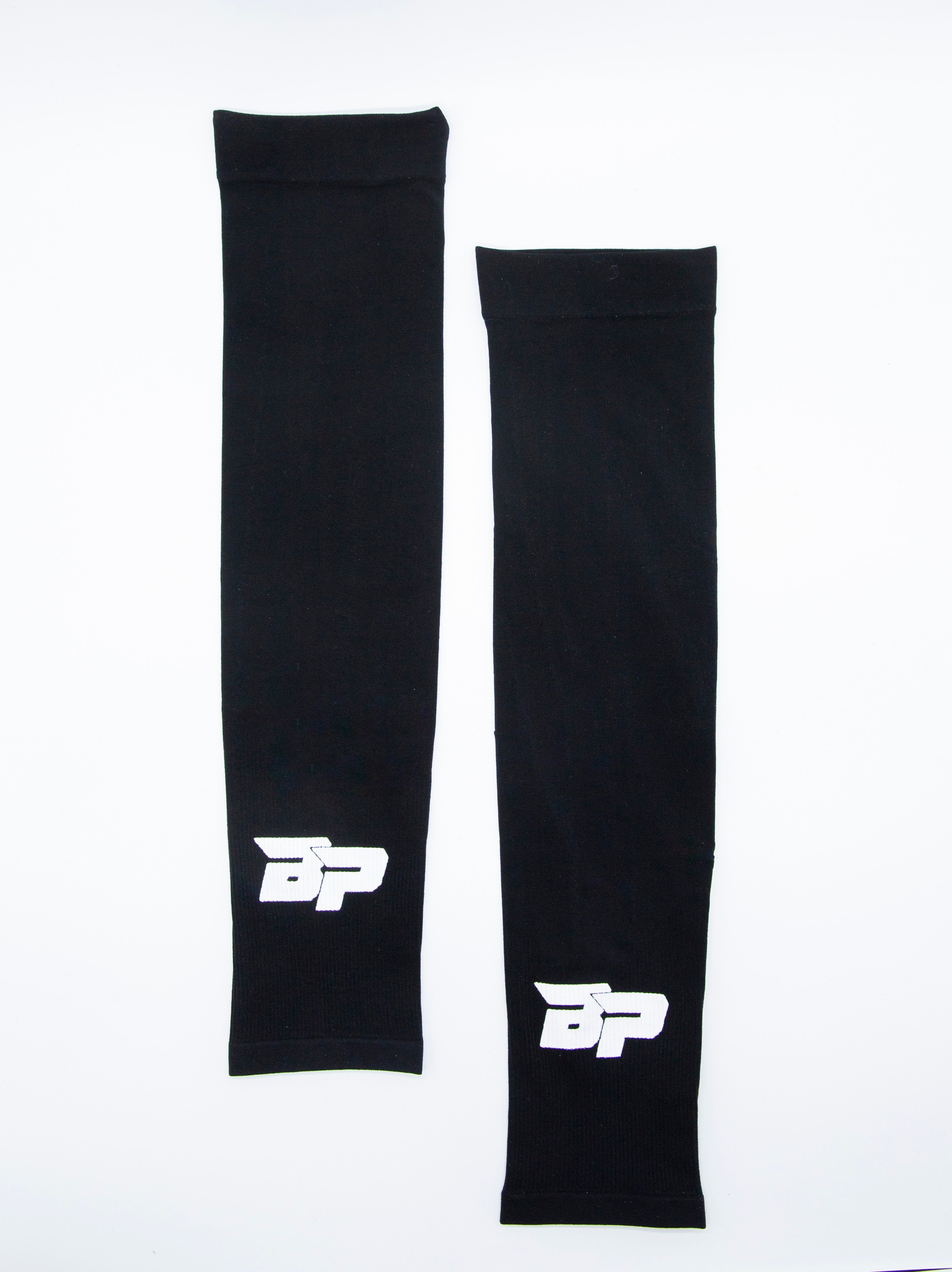 Black Performance Arm Sleeves by Bodhi Pickleball, featuring white "BP" logos, displayed as a pair of differing lengths on a white background.