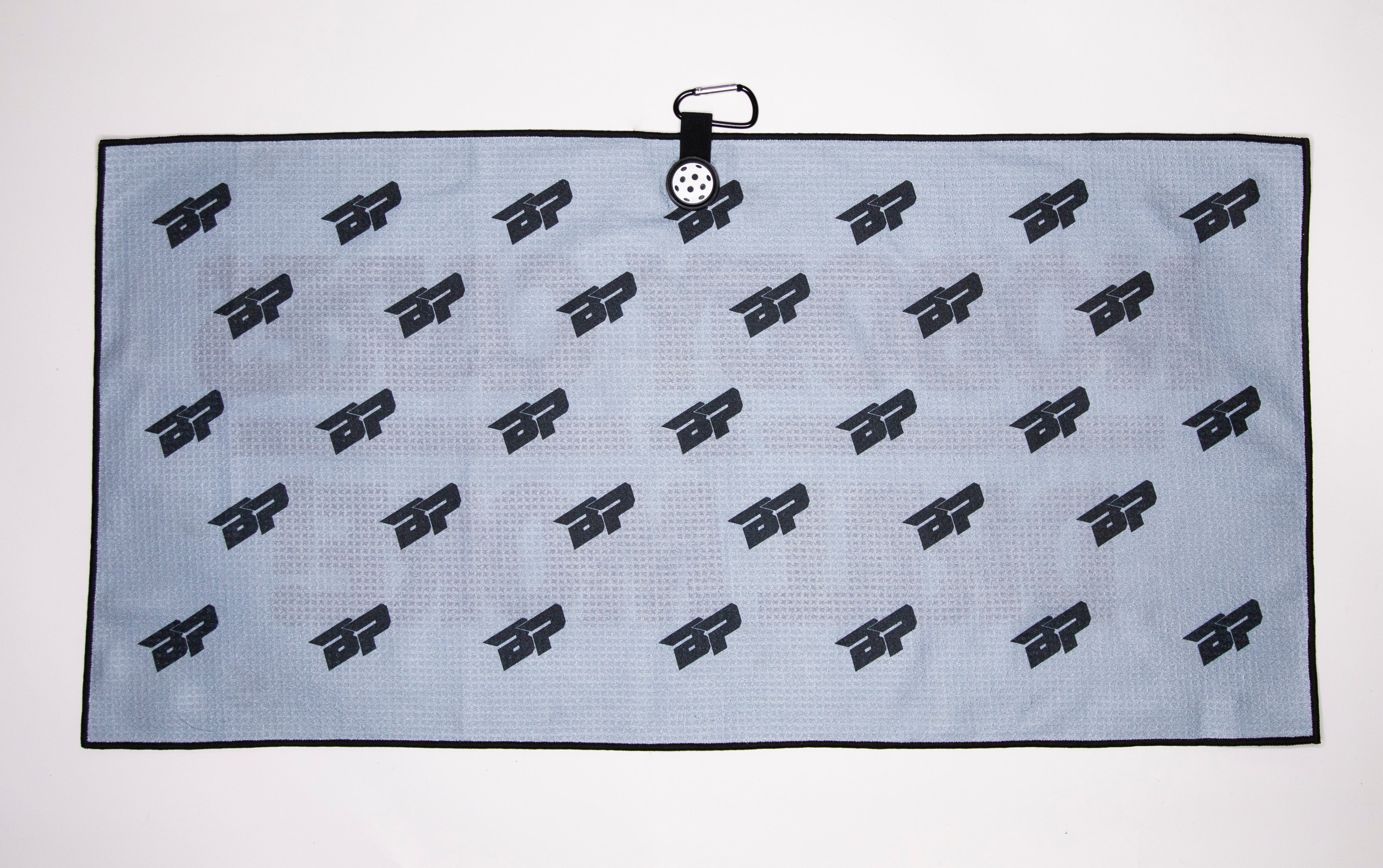 Blue towel with black logo pattern and clip.