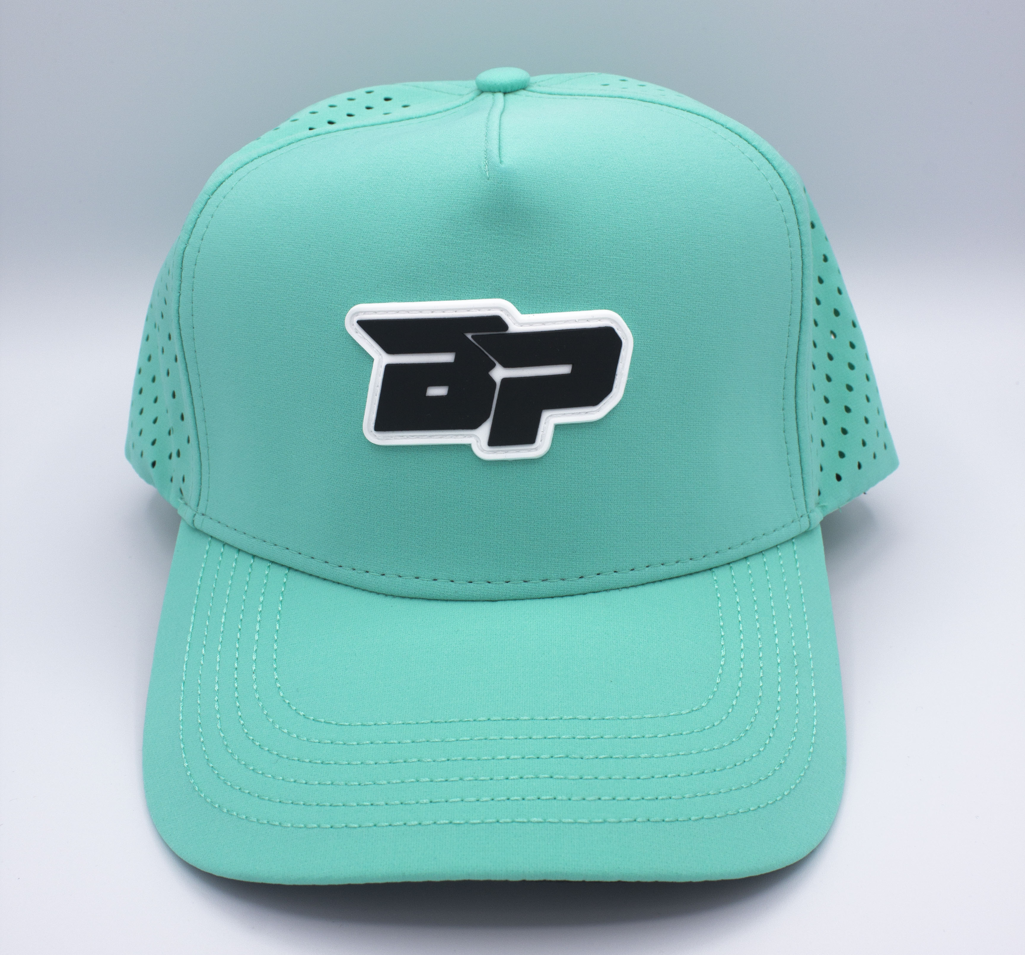 Aqua blue baseball cap with a black and white logo.