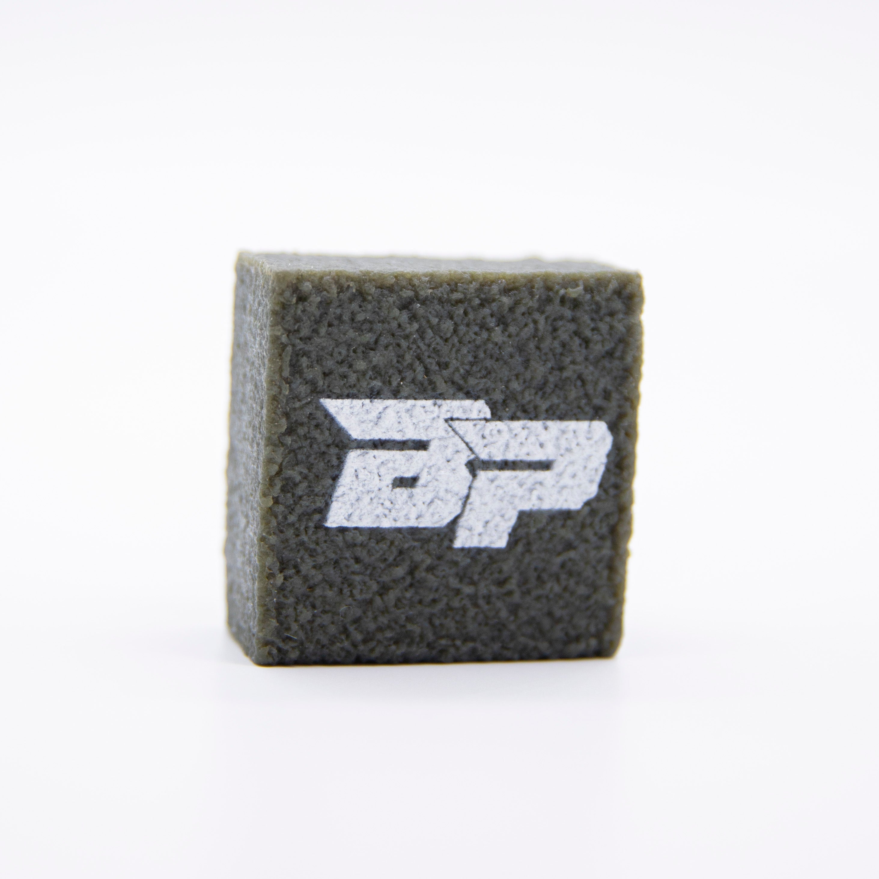 Gray textured cube with a white logo on a white background.