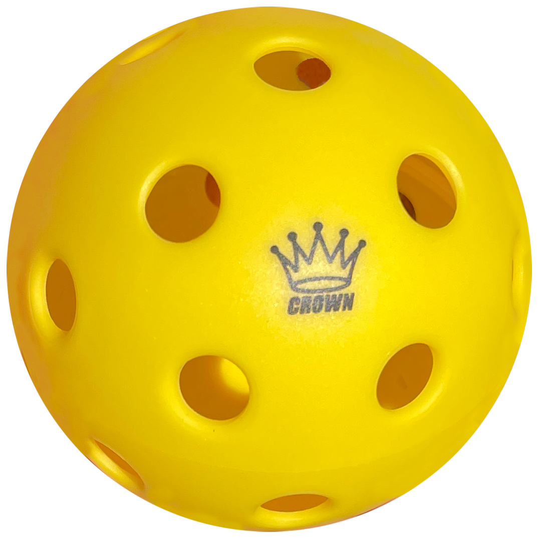 Yellow pickleball ball with holes and a "CROWN" logo.
