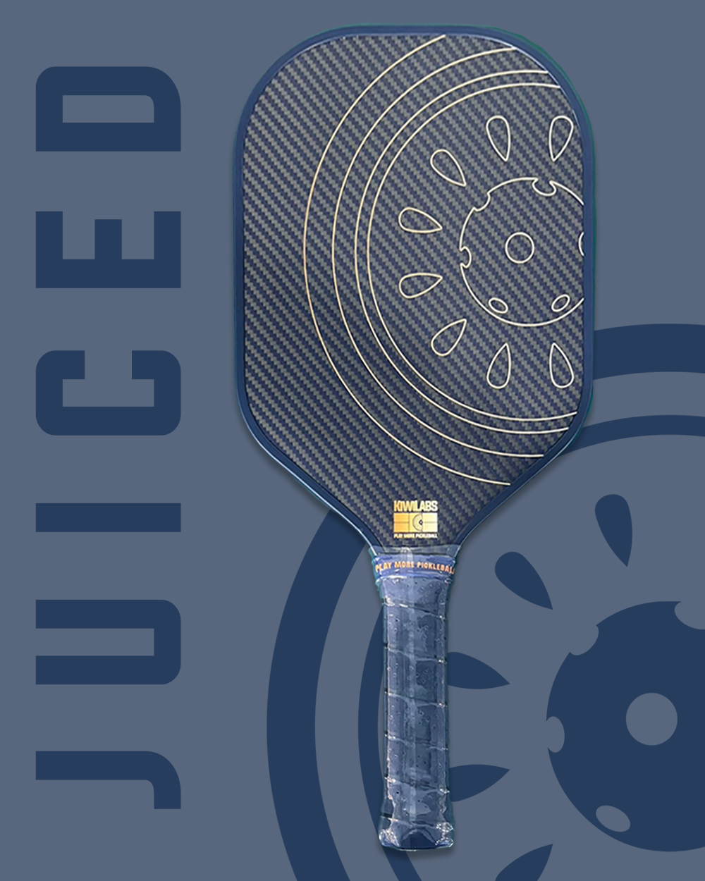 Pickleball paddle with blue grip and head, carbon fiber face, and an illustration of a fruit inside.
