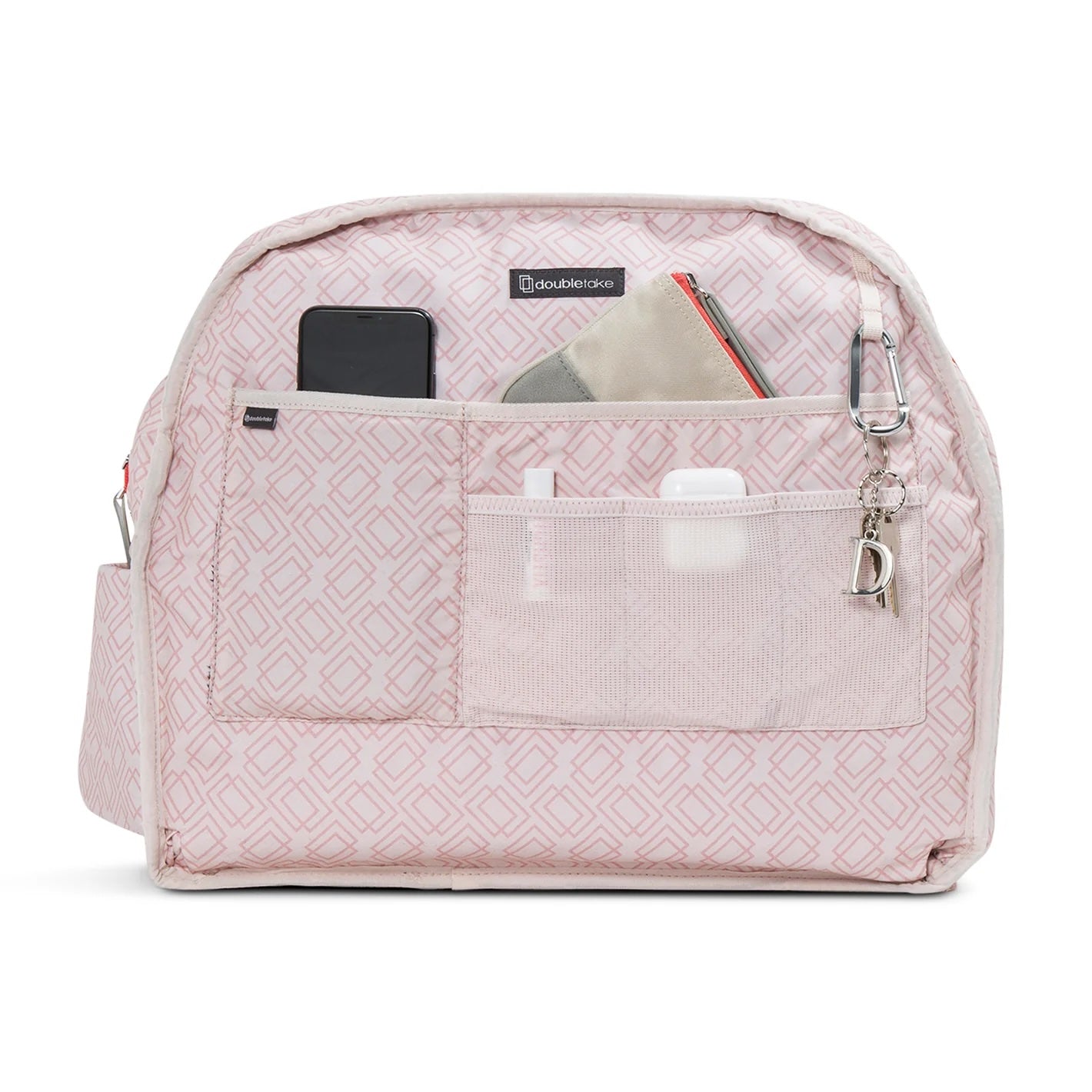 Light pink tennis duffel and tote by Doubletake, featuring a geometric diamond pattern interior, organized with a phone, wallet, earbuds, and keys.