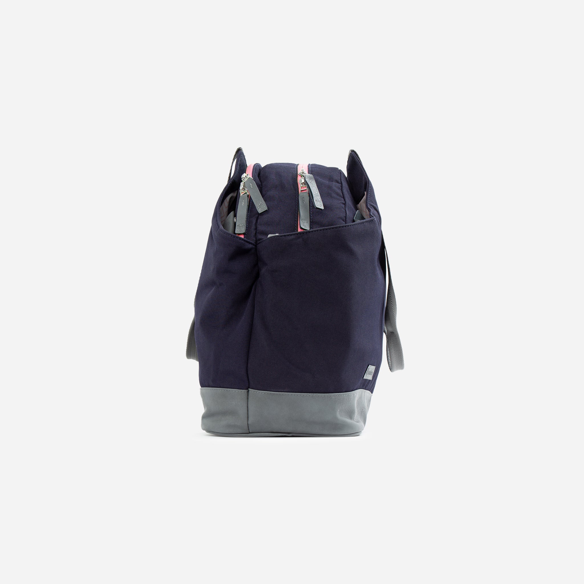 Dark navy and grey Tennis Duffel & Tote sport bag by Doubletake with pink zippers and grey straps, front view.