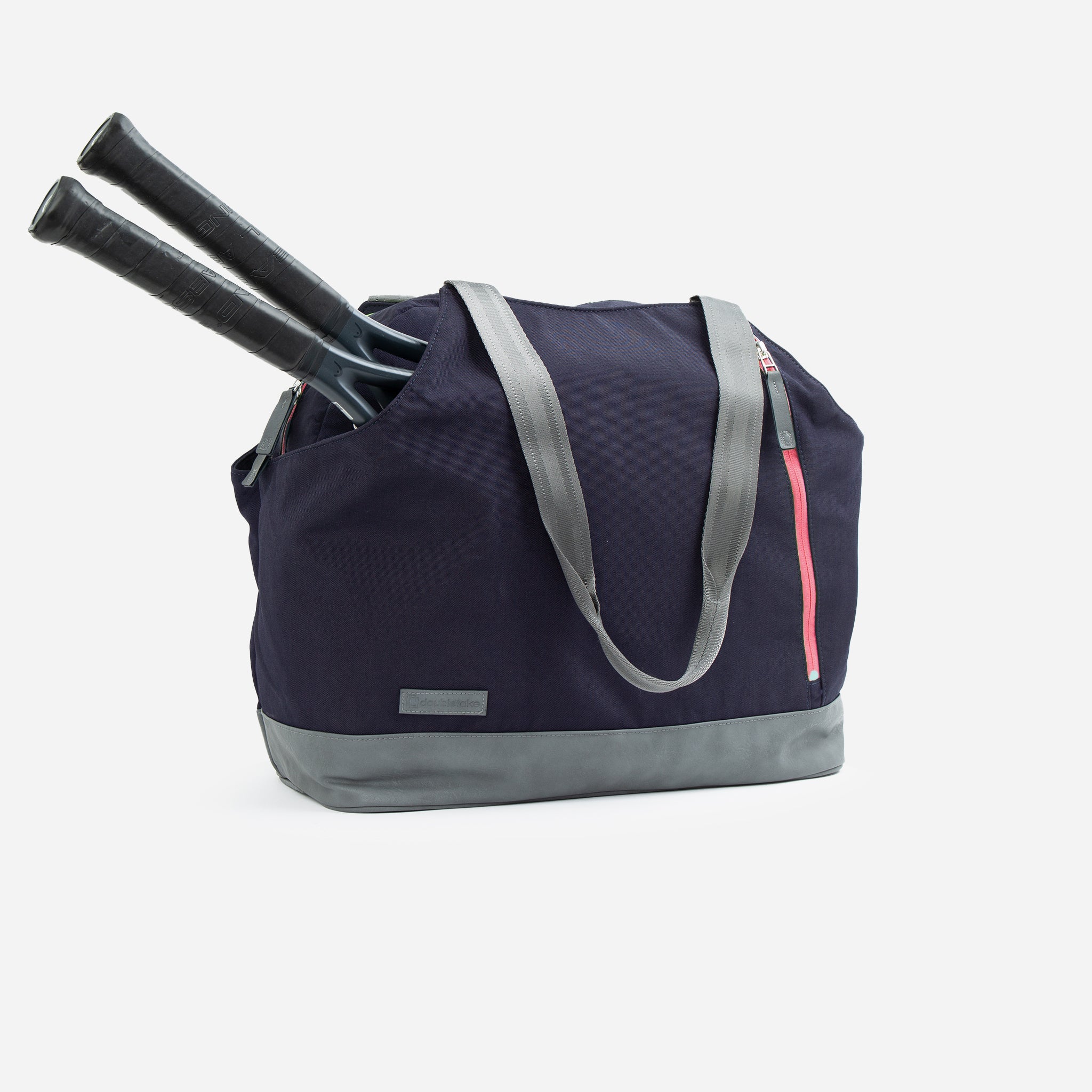 Navy blue and gray tennis duffel tote bag by Doubletake, featuring gray webbing handles, a gray base, a pink side zipper, and two black tennis rackets.