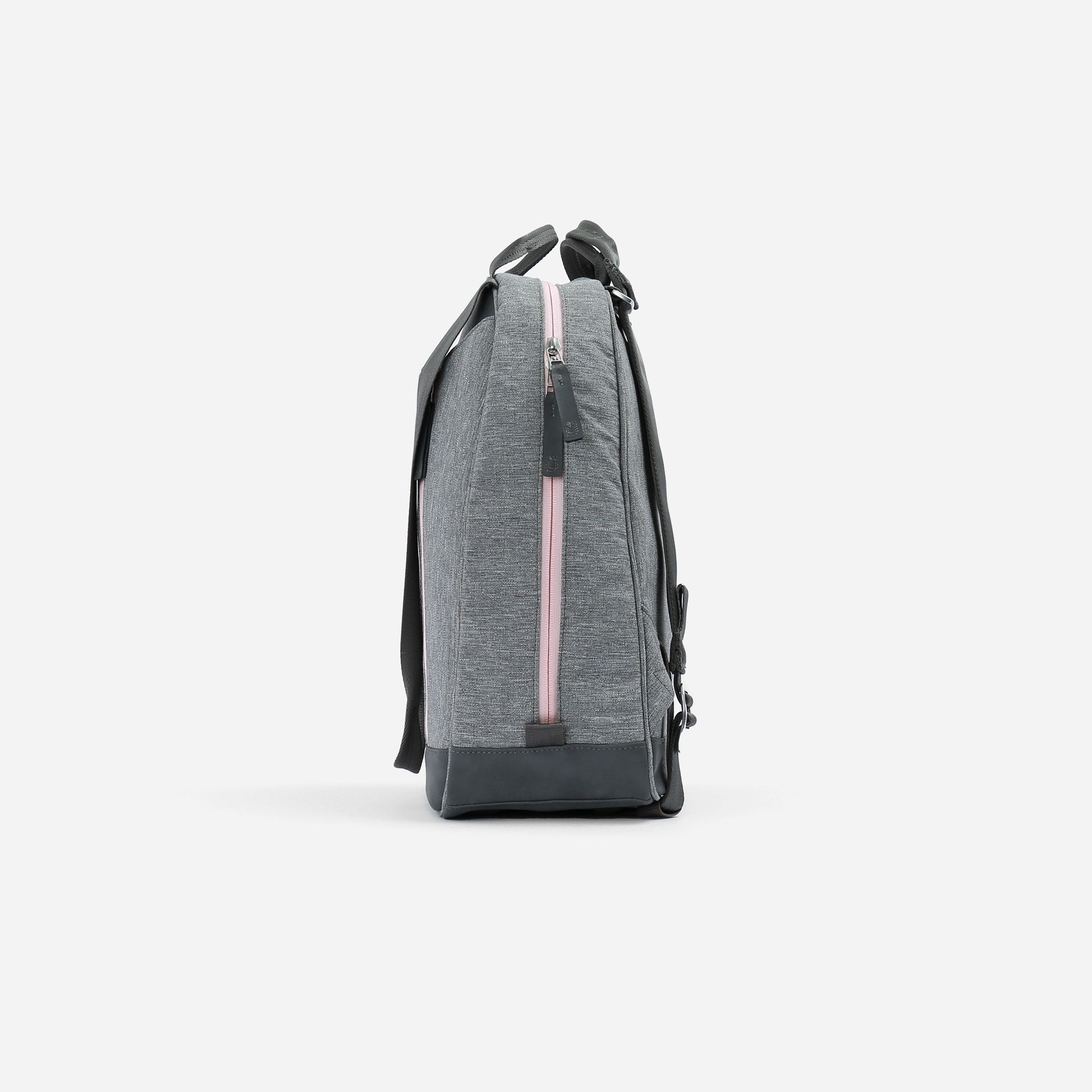Grey textured fabric pickleball backpack and tote by Doubletake with pink zipper and dark bottom panel, side view.