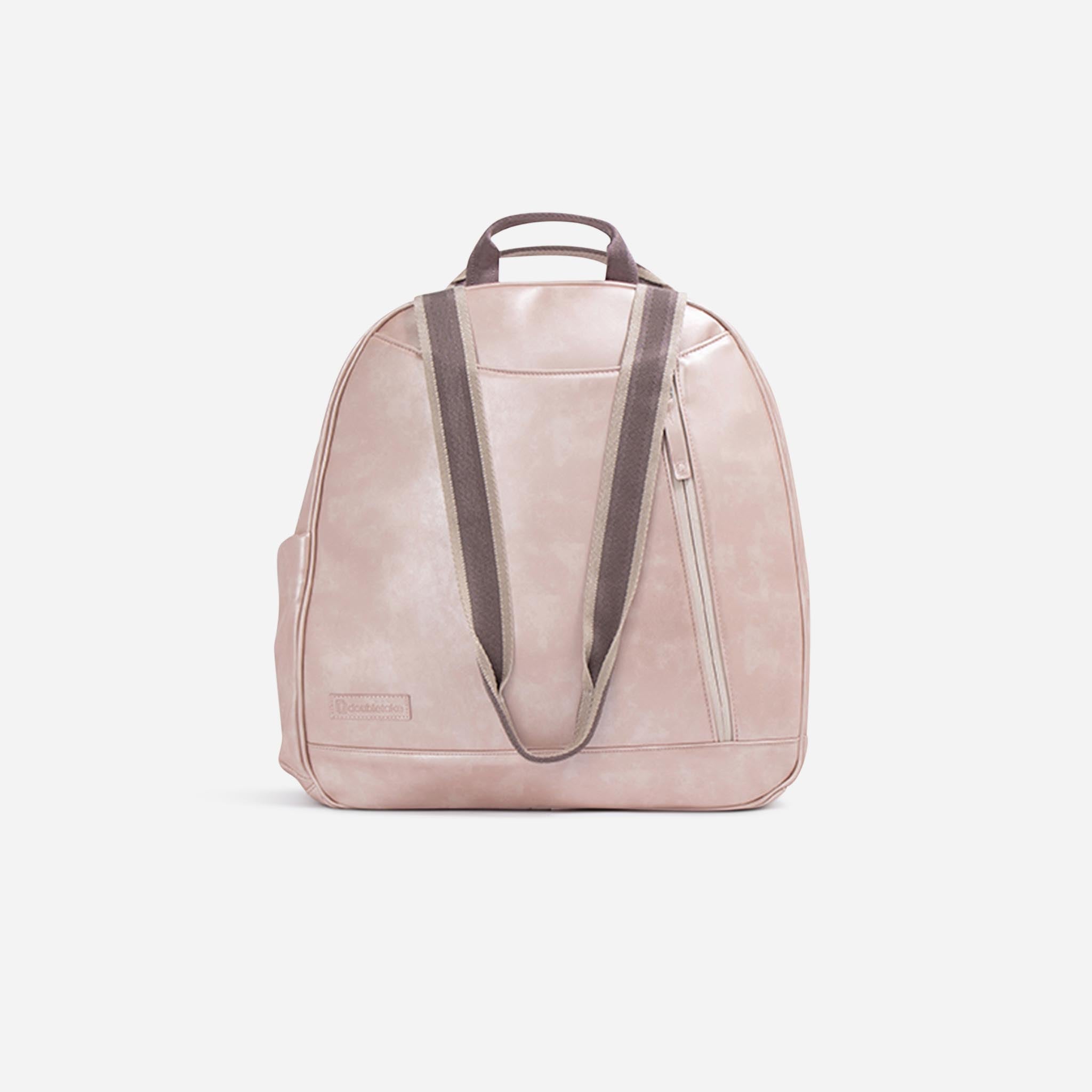 Pink metallic tennis backpack by Doubletake, back view with brown straps, a zippered pocket, and an embossed logo.