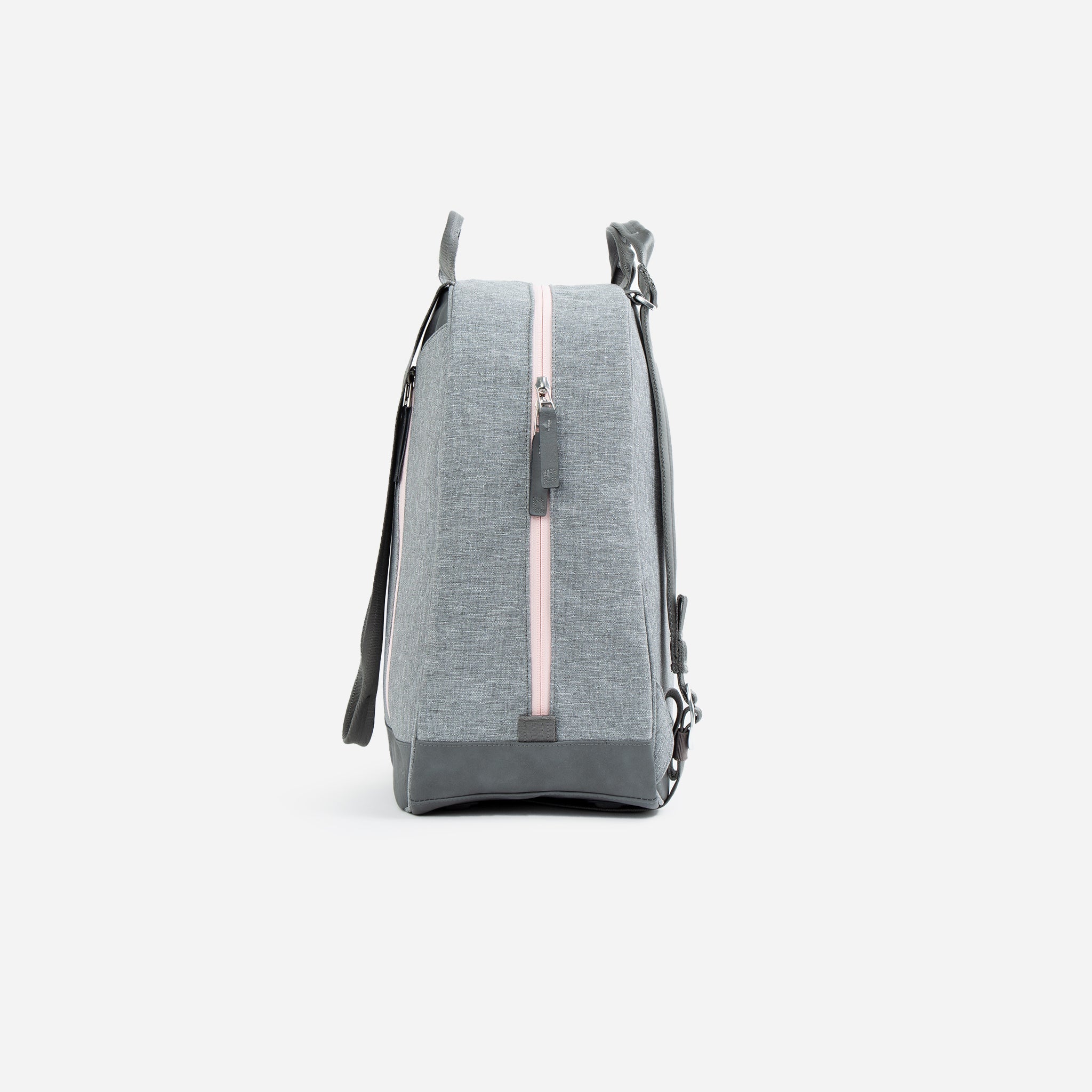 Grey pickleball backpack and tote by Doubletake with a pink vertical zipper, shown from a side angle.