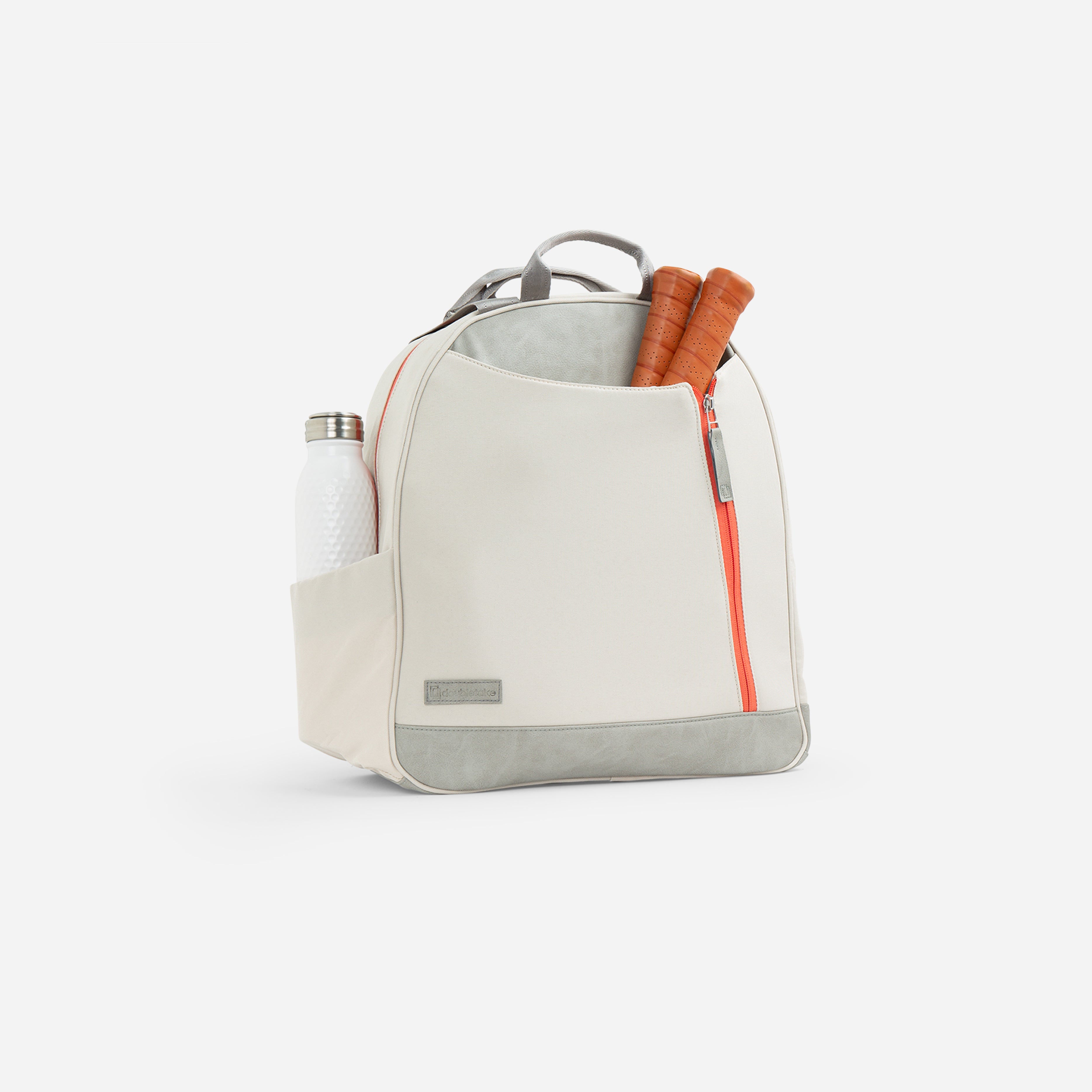 Backpack with water bottle and tennis racket handles.