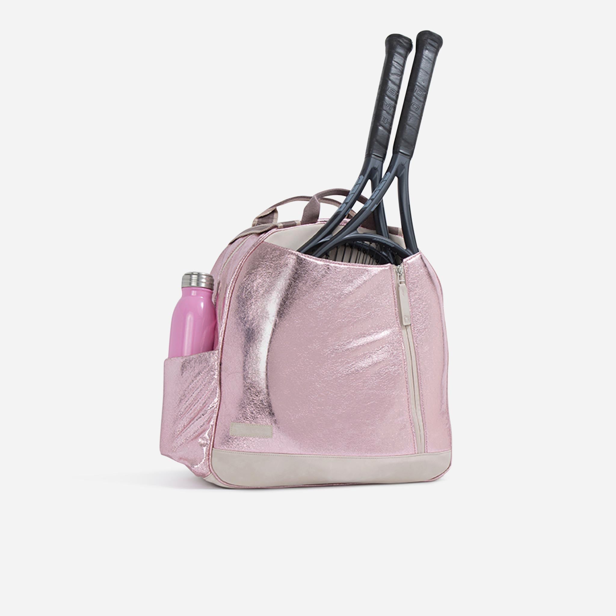 Metallic pink Tennis Backpack & Tote by Doubletake, holding two black tennis racquets and a pink water bottle.