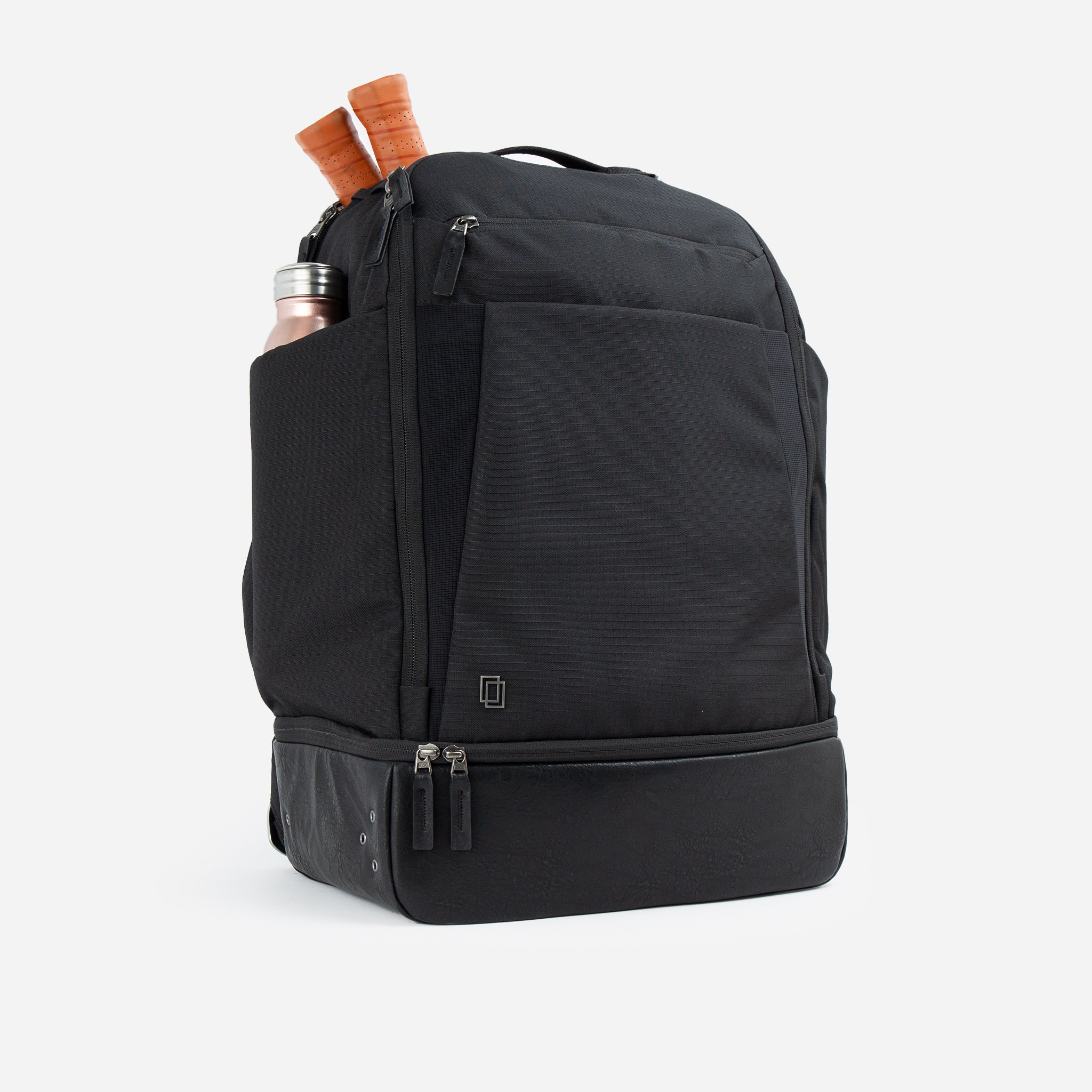 Black backpack with tennis rackets and a water bottle.