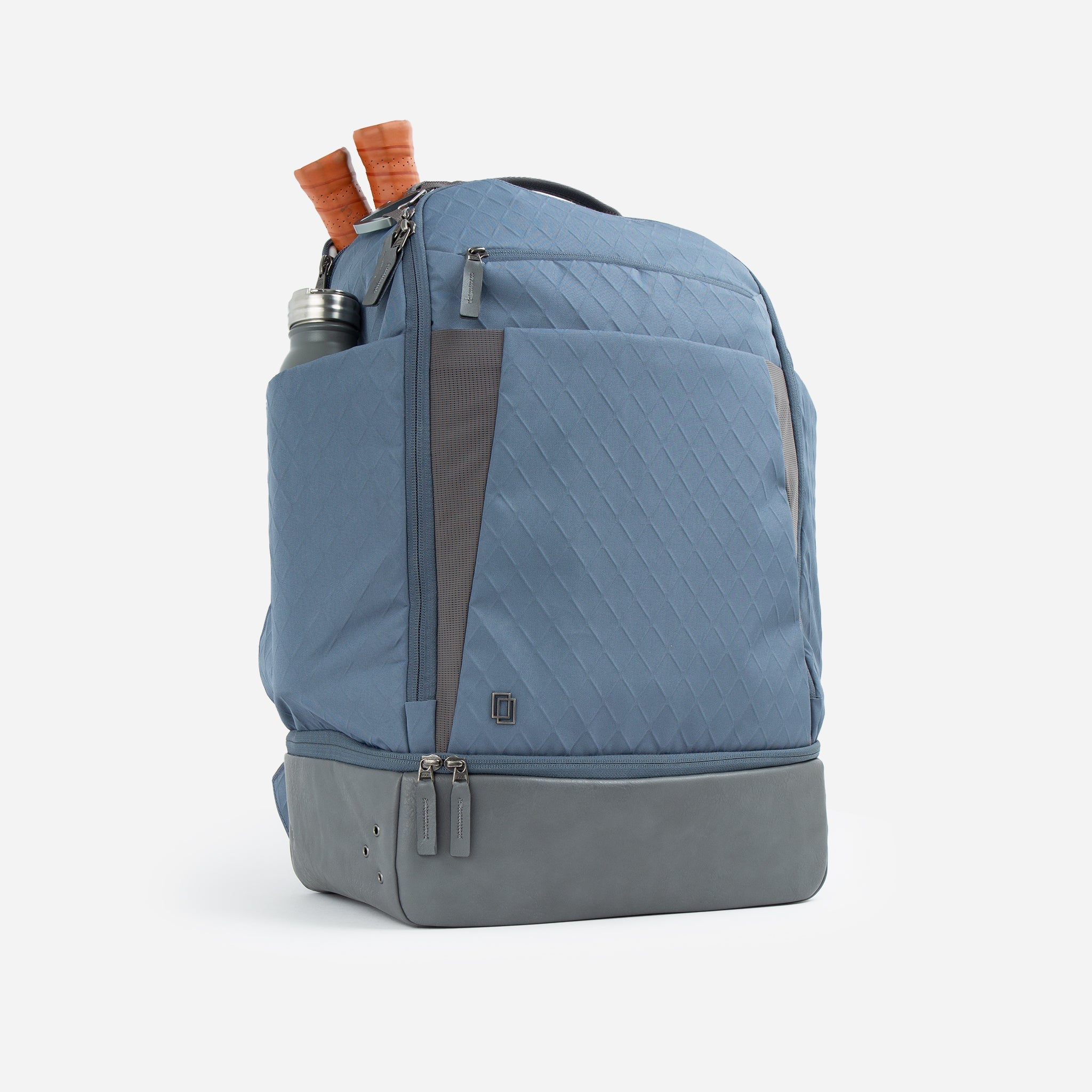 Blue backpack with rackets and water bottle.