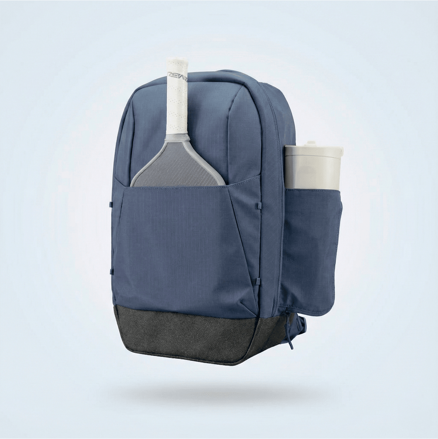 Dark blue pickleball backpack by FORWRD with a white pickleball paddle handle and bottle in side pockets, featuring a textured black base.