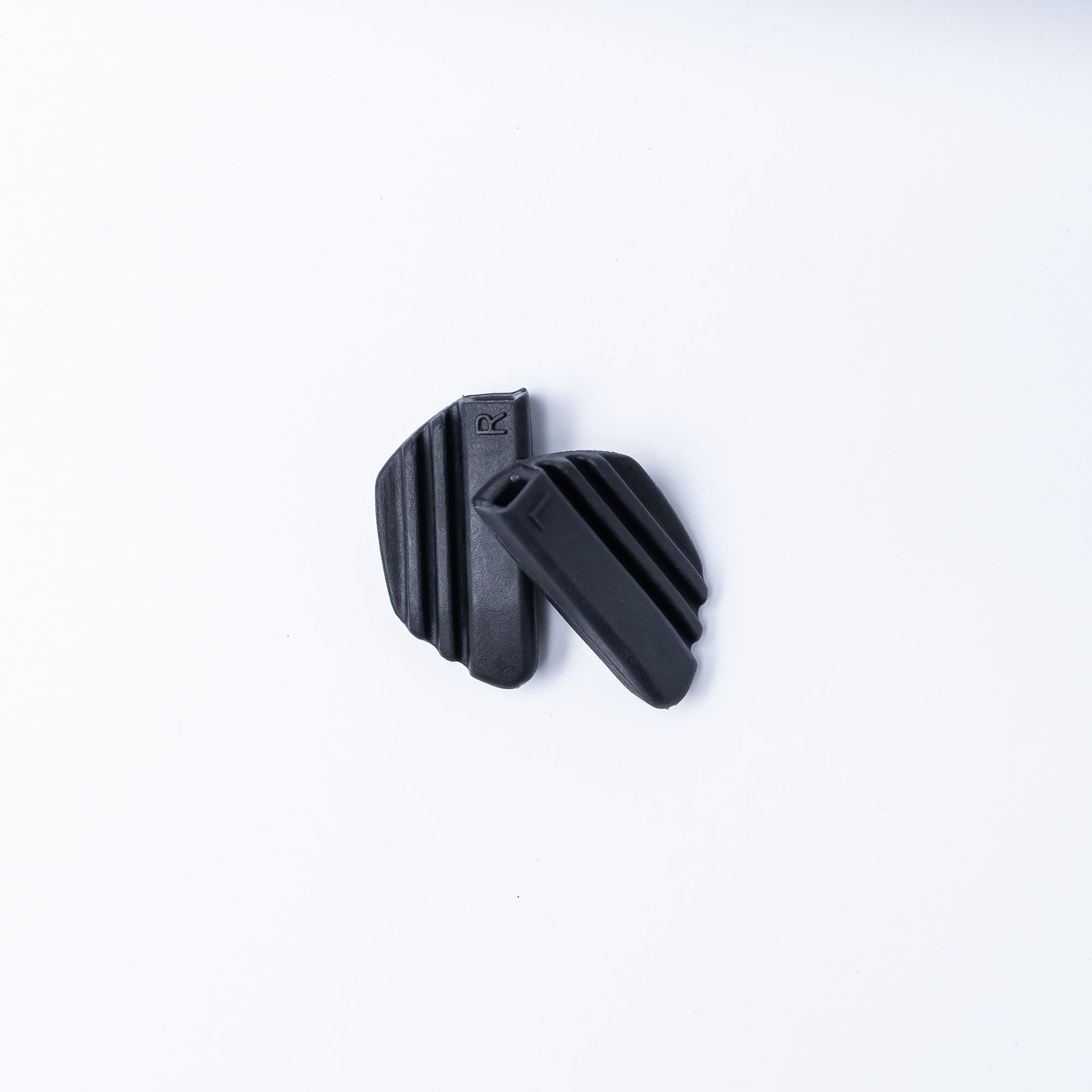 Two black rubber shoe grips.