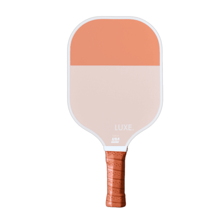 Pickleball paddle, orange and pink, white edge, textured grip.