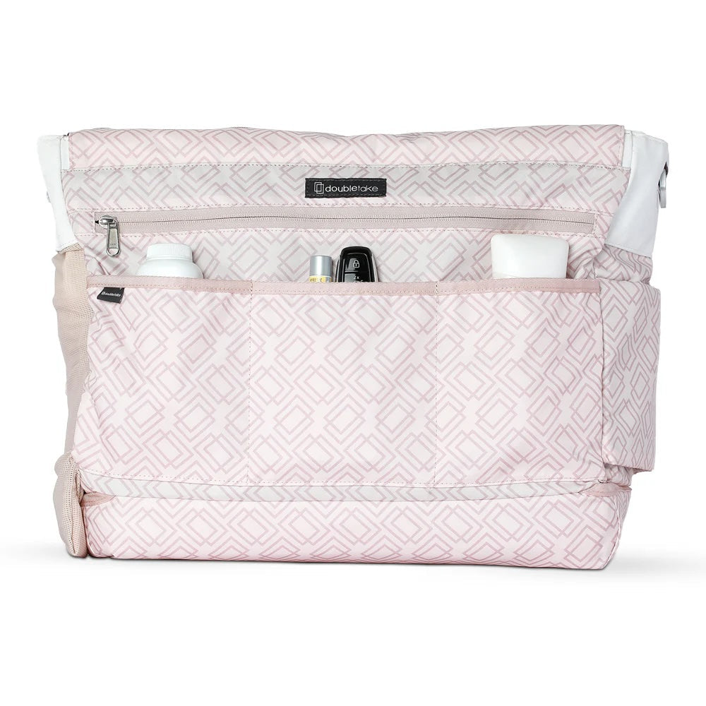 Light pink quilted tennis tote by Doubletake, featuring a geometric diamond pattern, an open top with multiple organized pockets holding a bottle, car key, and small items.