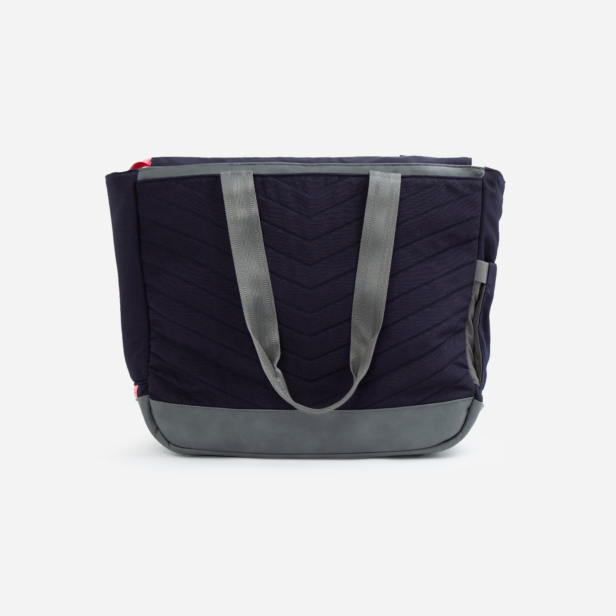 Dark navy blue quilted tennis tote by Doubletake with grey webbing handles, a grey faux leather base, and a side slip pocket.