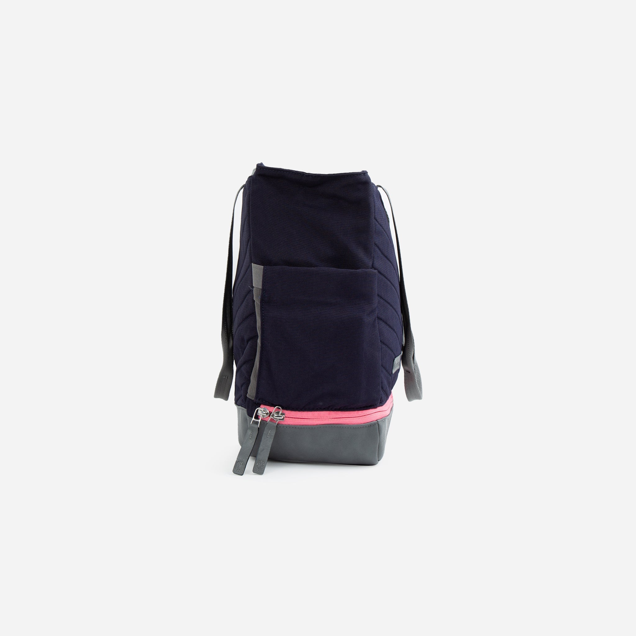 Navy blue quilted Tennis Tote by Doubletake with a grey base, pink zippered compartment, and grey straps.