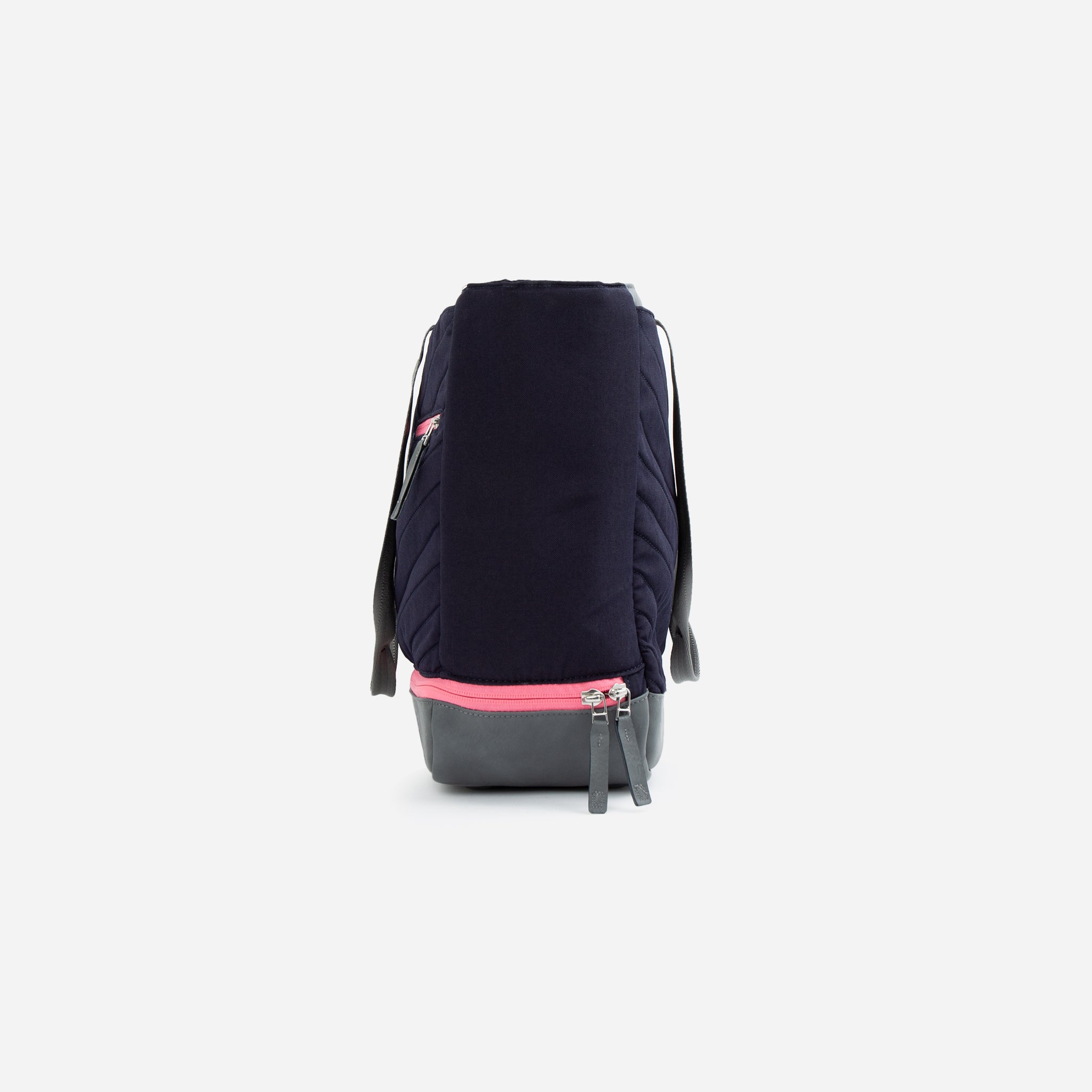 Navy quilted tennis tote bag by Doubletake with a pink zippered base and grey straps, shown from the side.