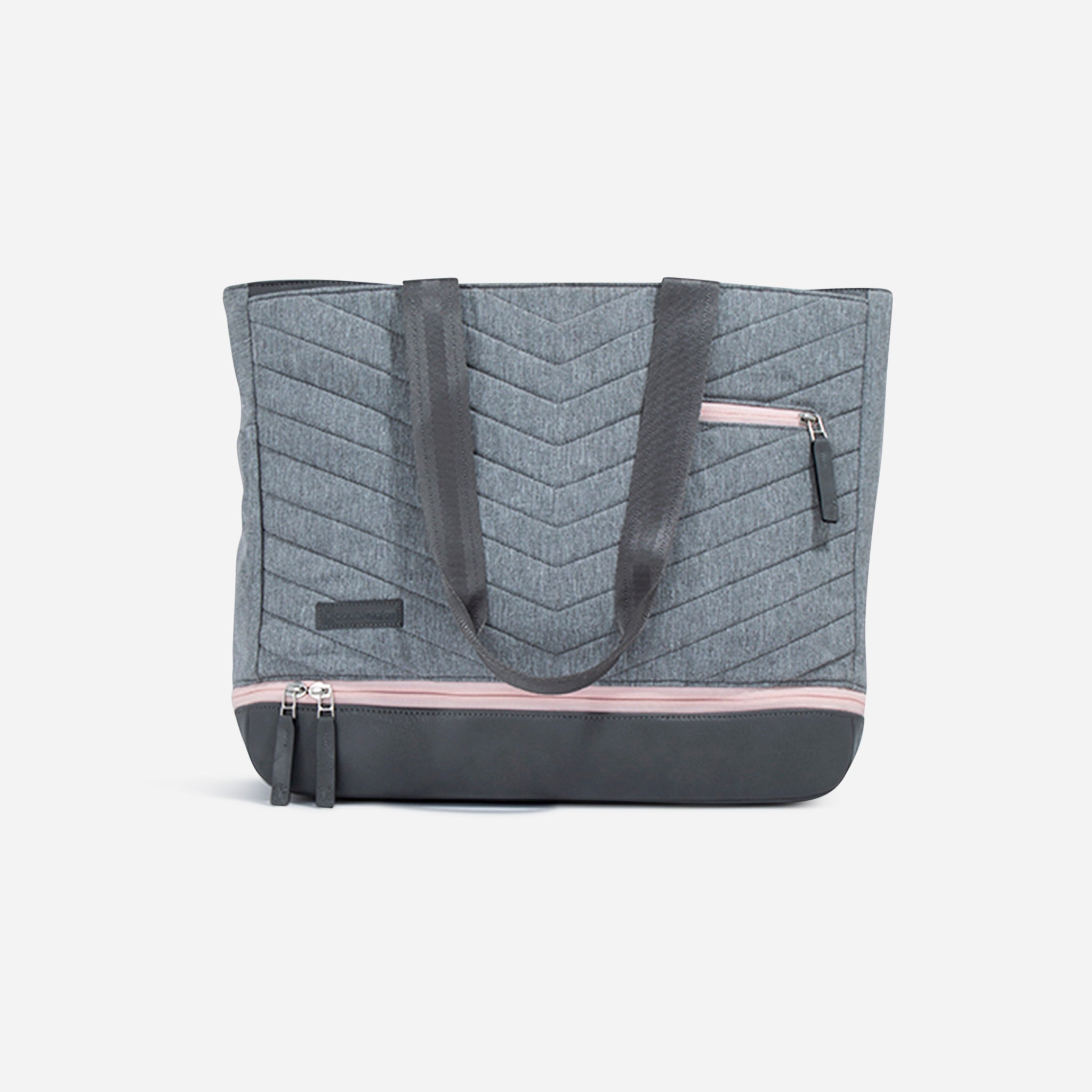 Grey quilted pickleball tote by Doubletake with chevron pattern, dark grey base, and pink zipper accents.