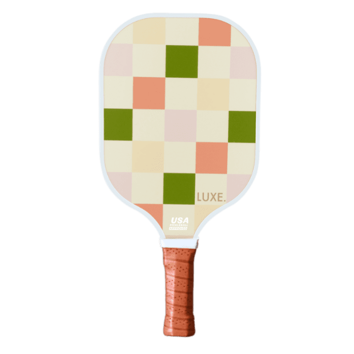 A pickleball paddle with a checkered pattern and a brown, textured handle.