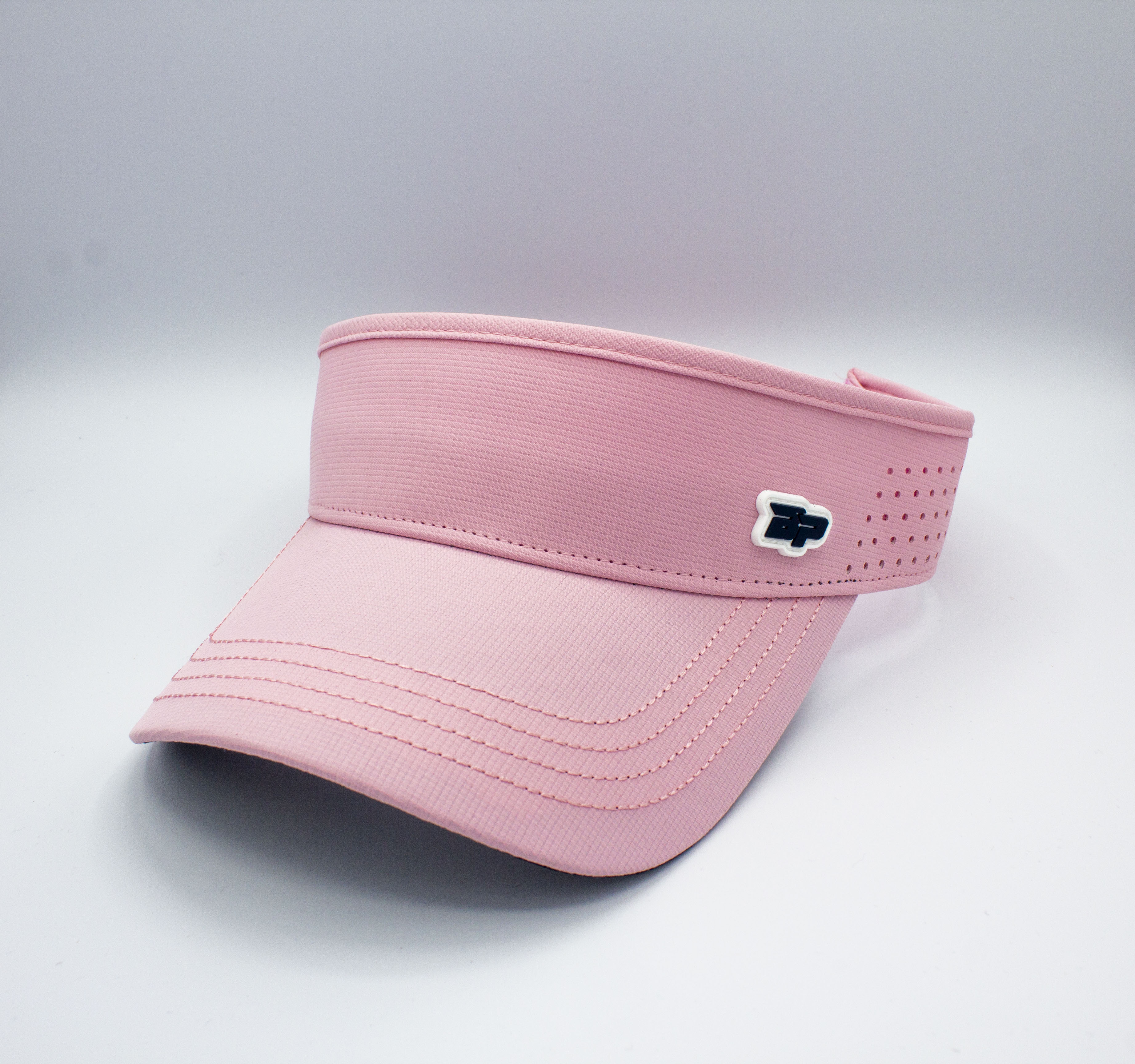 Pink visor with black and white logo.

