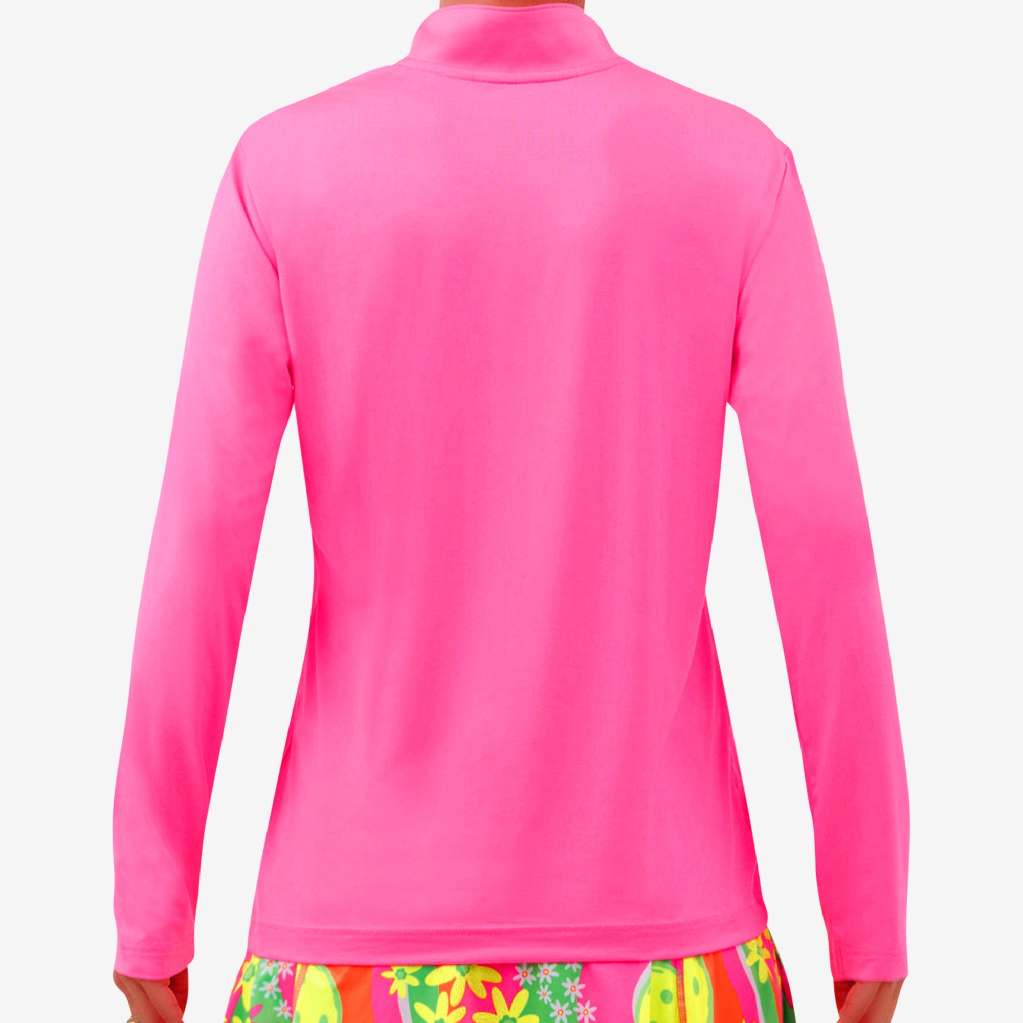 Hot pink 1/4 zip long sleeve pullover by Pickleball Bella, back view, paired with a colorful floral skirt.