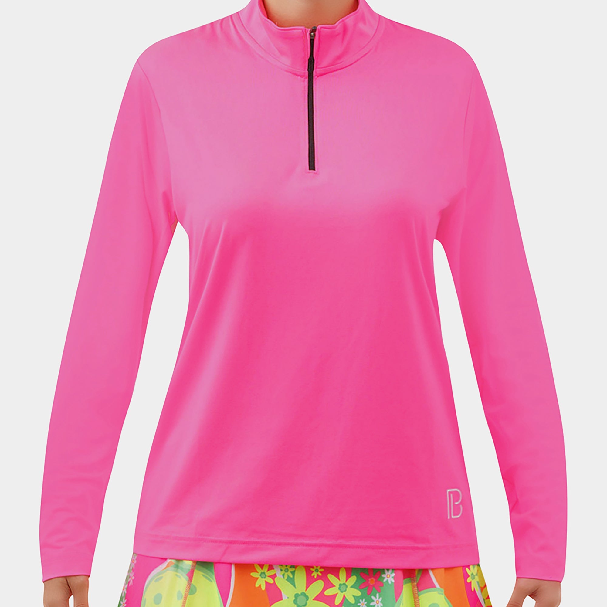 Hot Pink Long Sleeve 1/4 Zip Pullover by Pickleball Bella, with black zipper, B logo, worn over floral skirt.