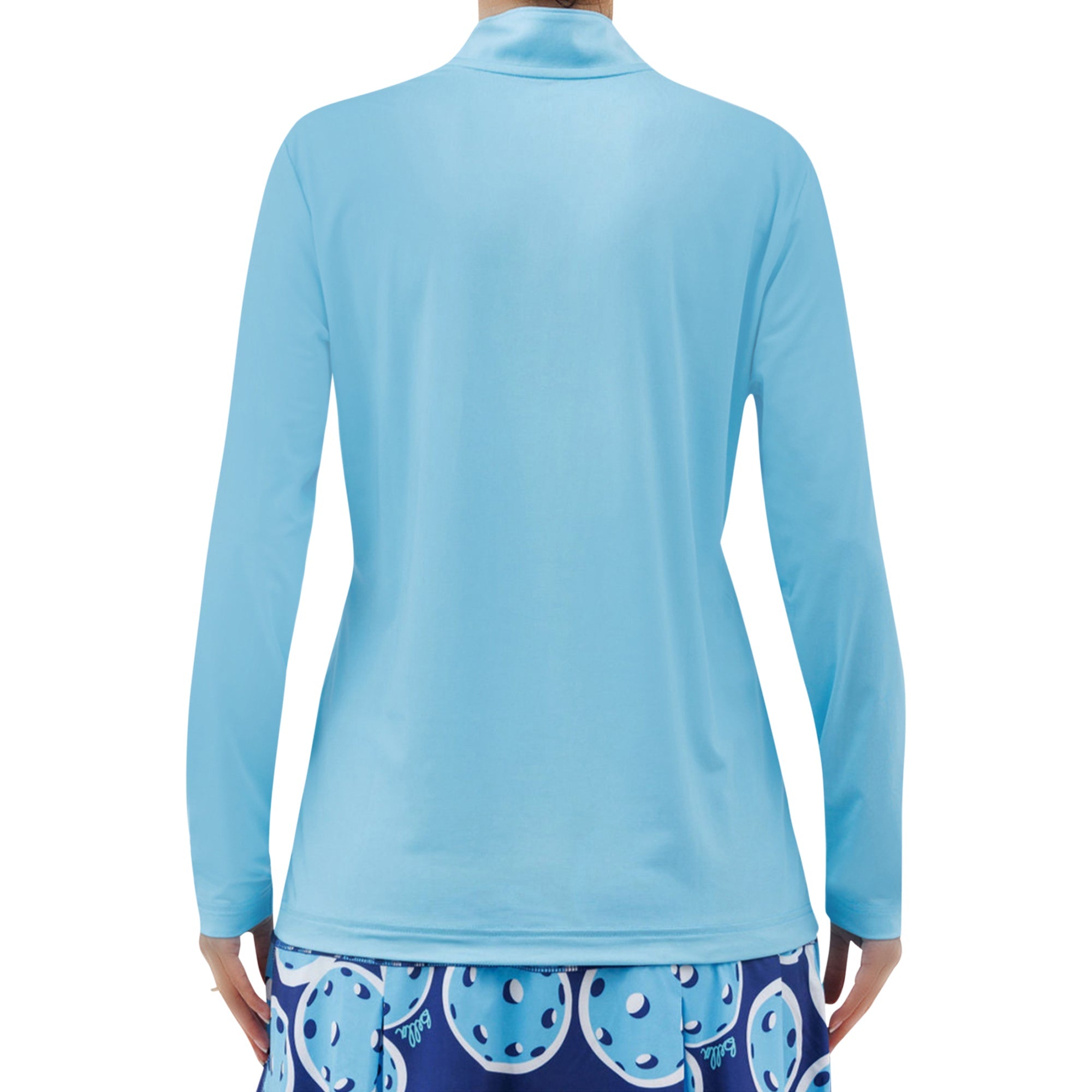 Sky Blue long sleeve 1/4 zip pullover by Pickleball Bella, shown from the back, with a high collar and a patterned blue skirt.
