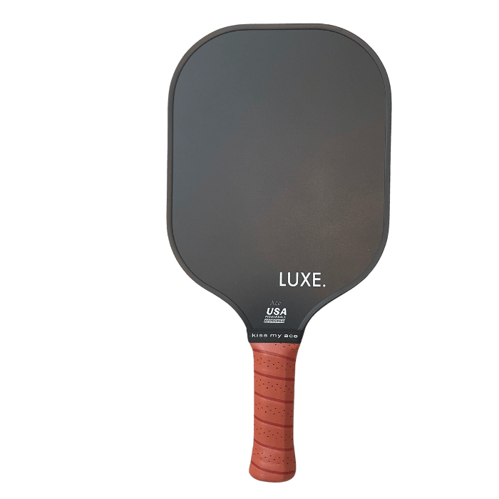 Black pickleball paddle with orange handle.