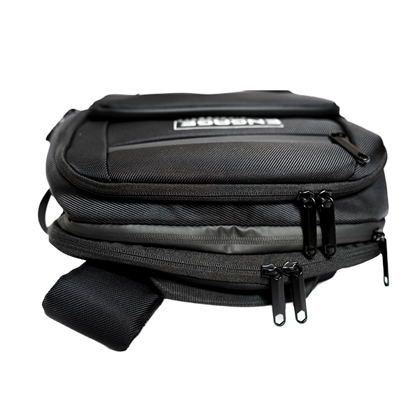 Black stealth backpack by EngagePickleball, with a textured finish, visible 'ENBORN' logo, and multiple black zippered compartments, viewed at an angle.