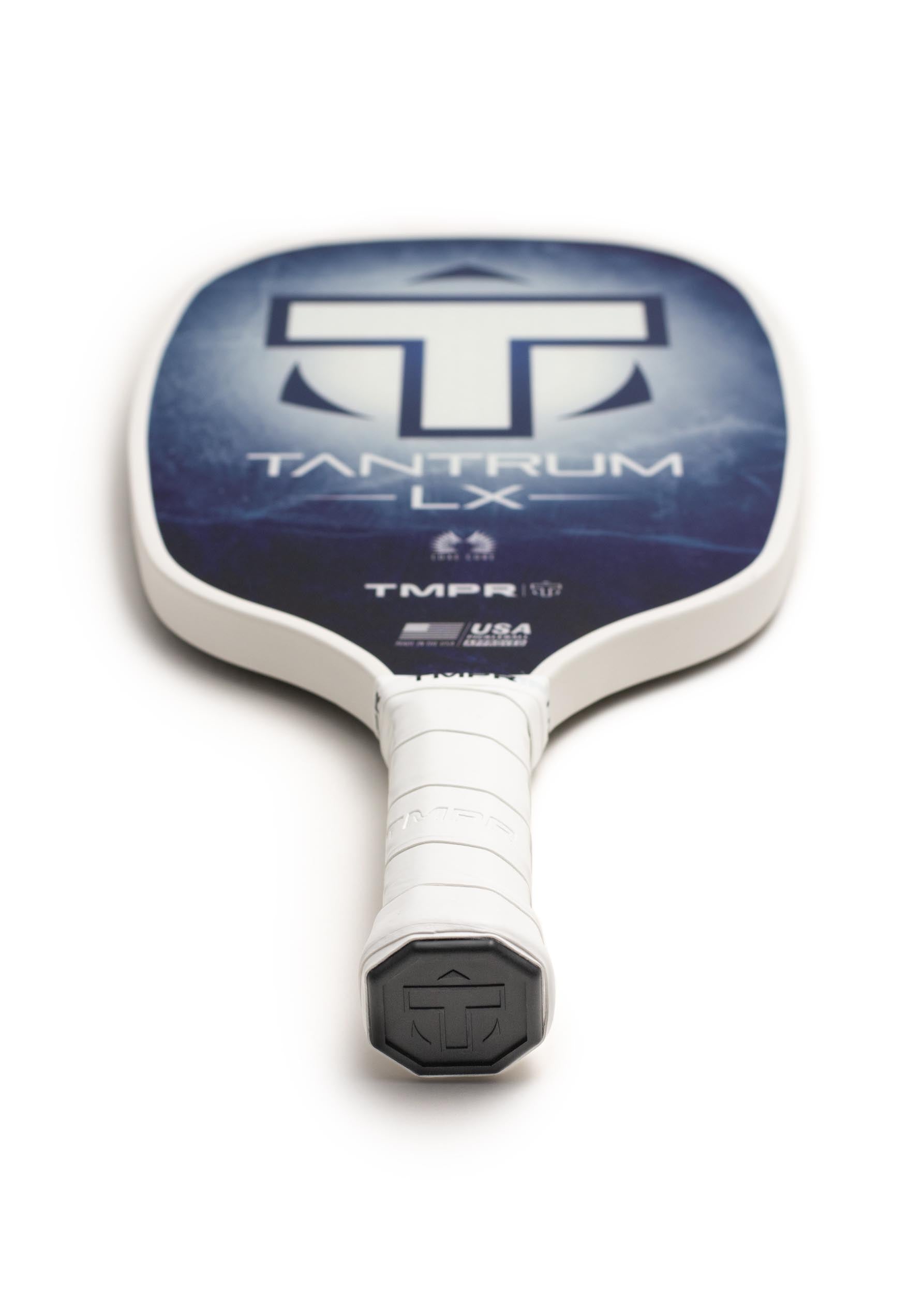 Pickleball paddle in indigo ice pattern by TMPR Sports, with a white handle and black end cap.