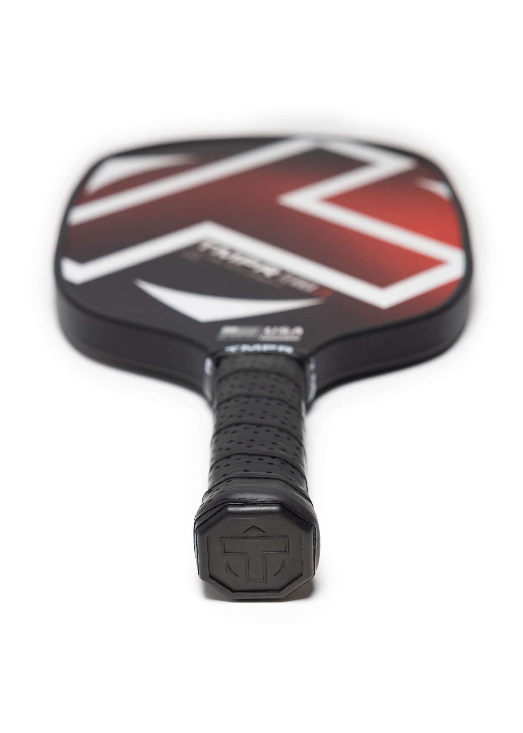Black and red pickleball paddle by TMPR Sports with a white geometric design and textured black grip.