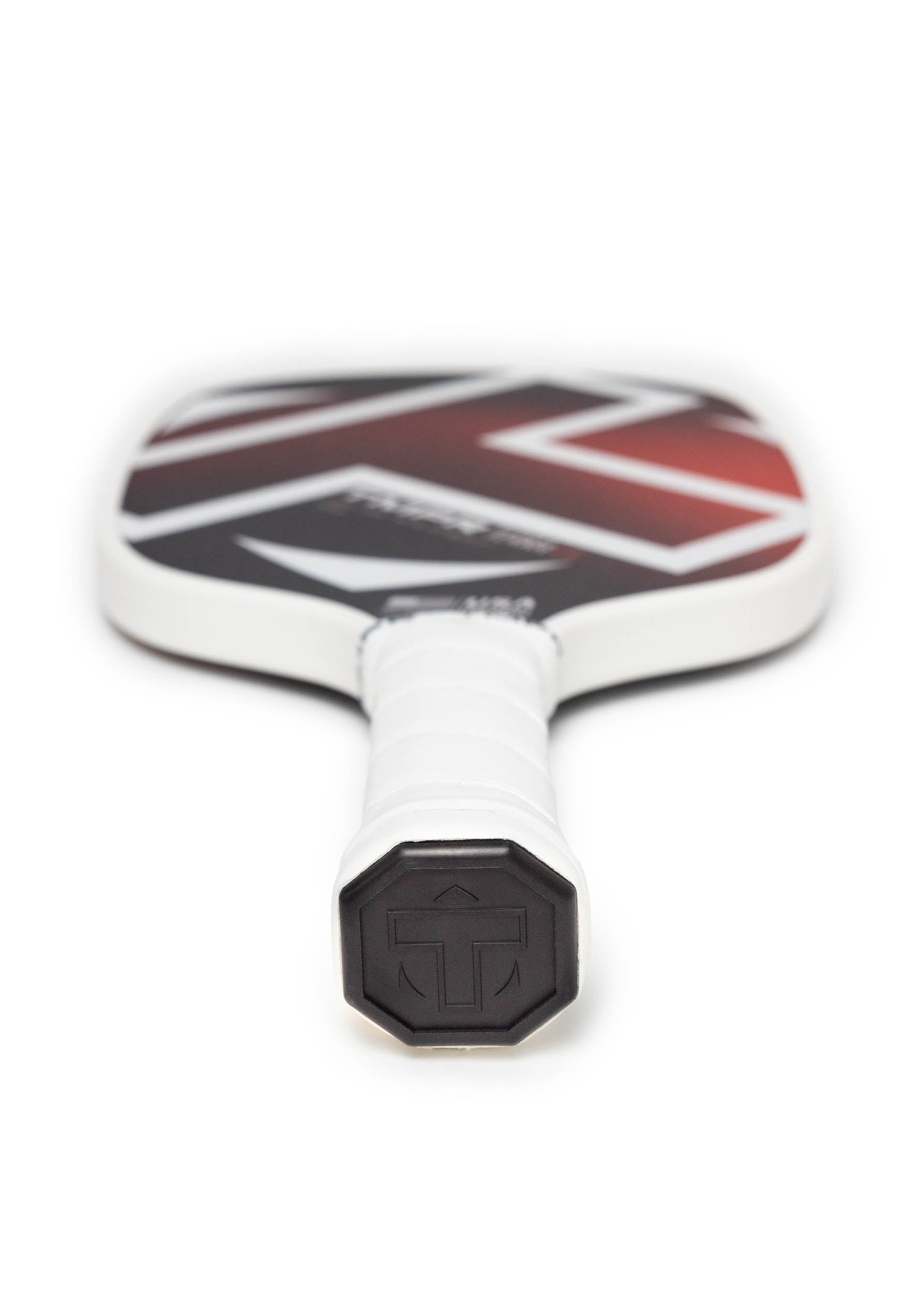 Black and red pickleball paddle with a white grip by TMPR Sports, featuring a geometric design and logo on the handle end.