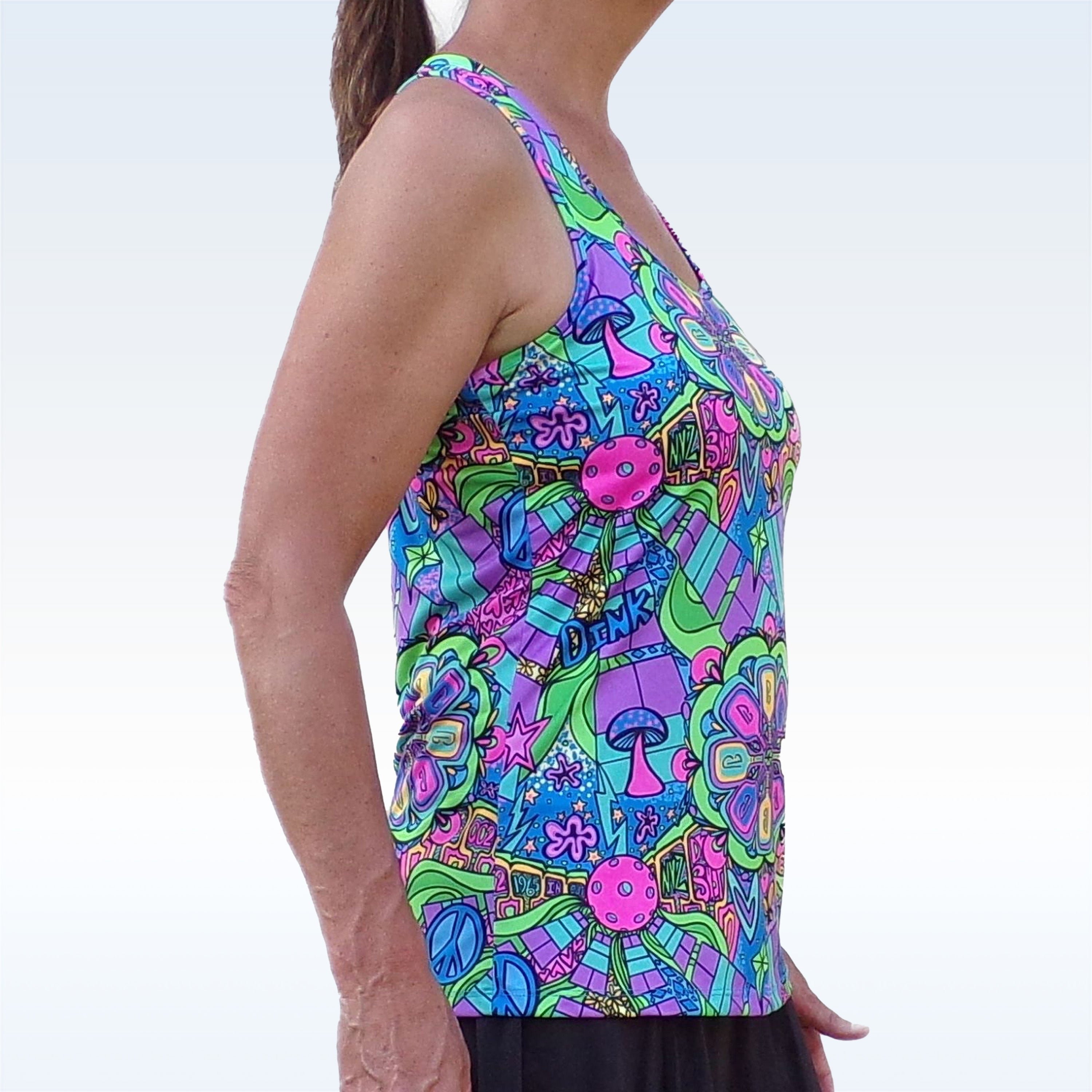 Multicolor Groovy Racerback Tank by Pickleball Bella with psychedelic pattern featuring mushrooms and peace signs, side view.