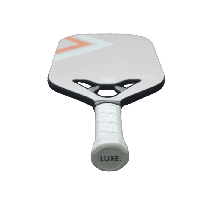 White pickleball paddle with orange and light blue geometric design, by Luxe, featuring textured grip and black edge trim, front view