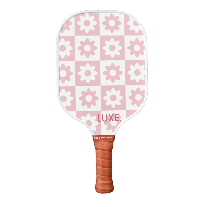 Pink and white checkered pickleball paddle with floral pattern and brown grip.