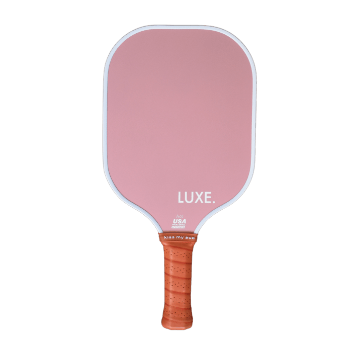 Pink pickleball paddle with orange grip.