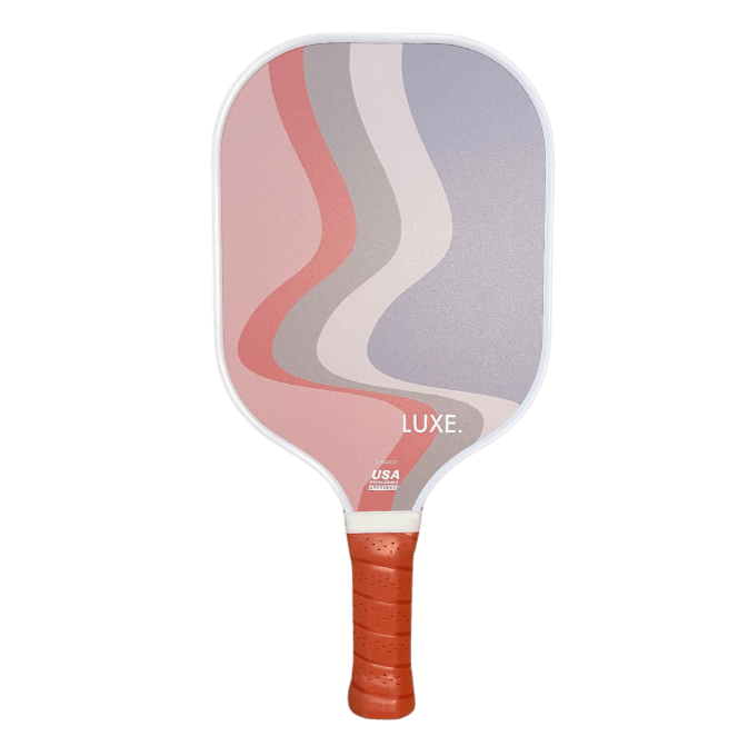 A pickleball paddle with a red handle.