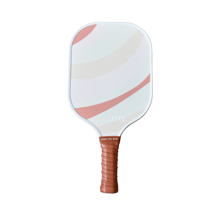 Pickleball paddle with curved pink and beige stripes, brown leather-like grip, text "LUXE." and "kiss my ace".

