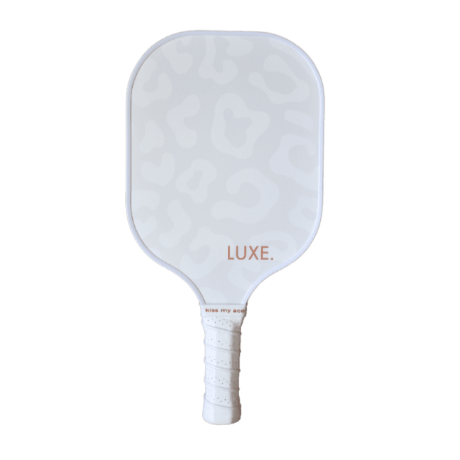 White pickleball paddle with leopard print and a wrapped grip.