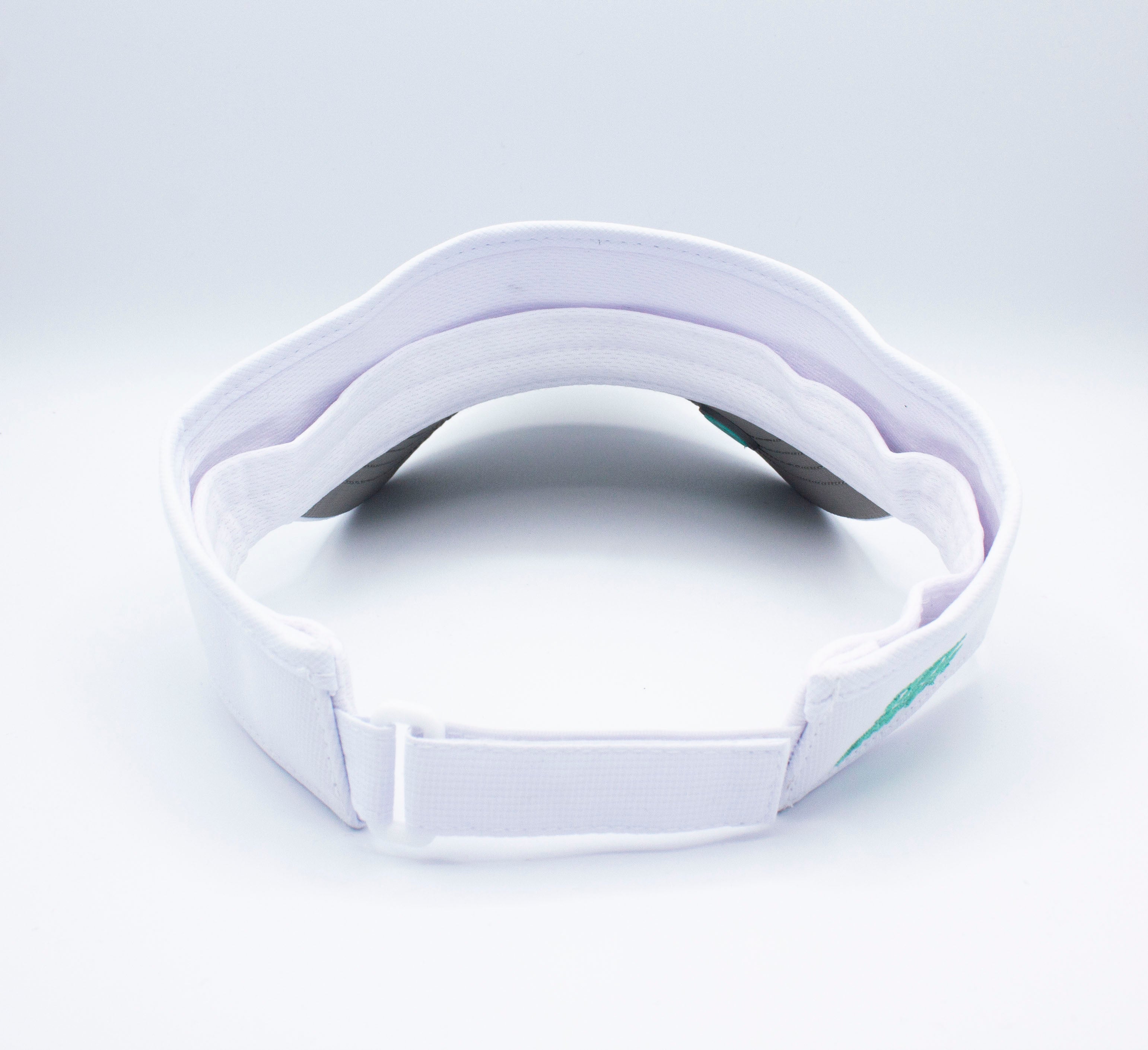 White visor with adjustable strap.