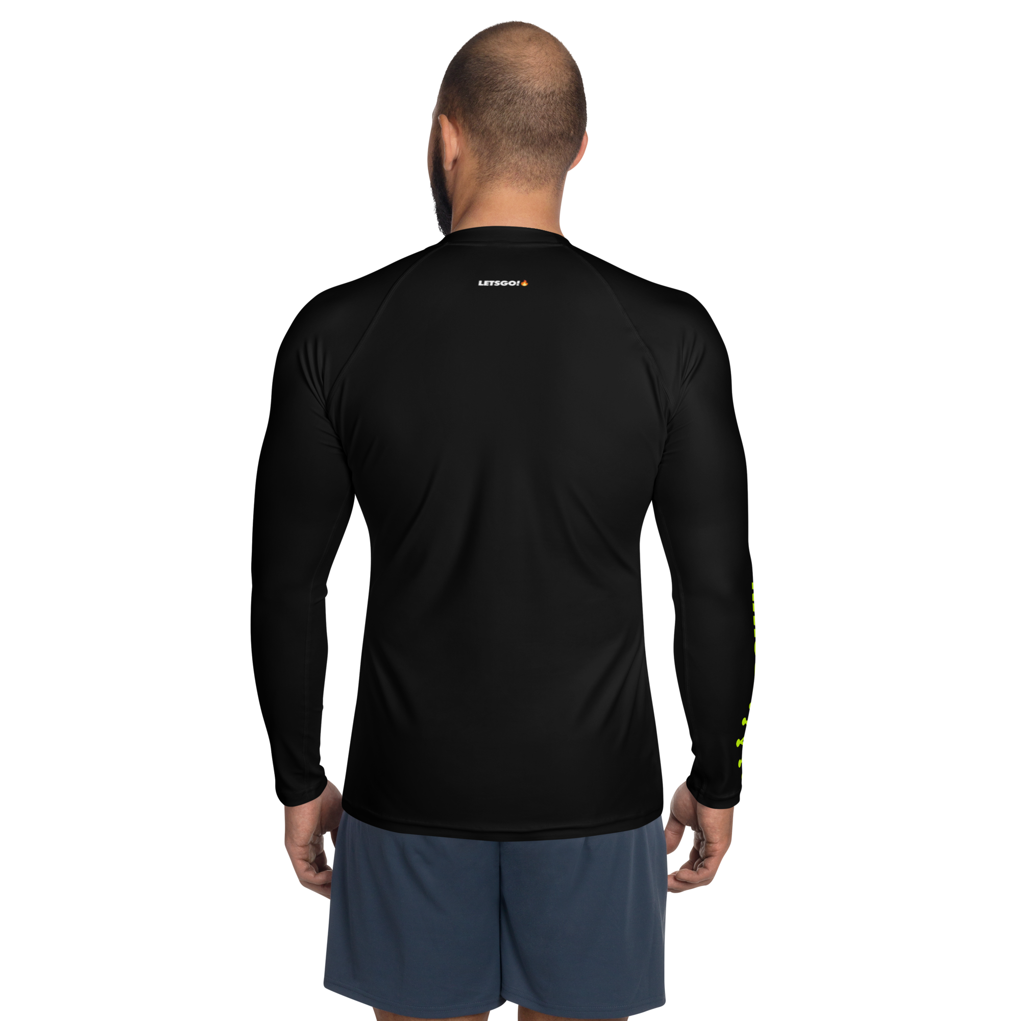 Back view of a man wearing a black long-sleeved athletic shirt and blue-gray shorts.