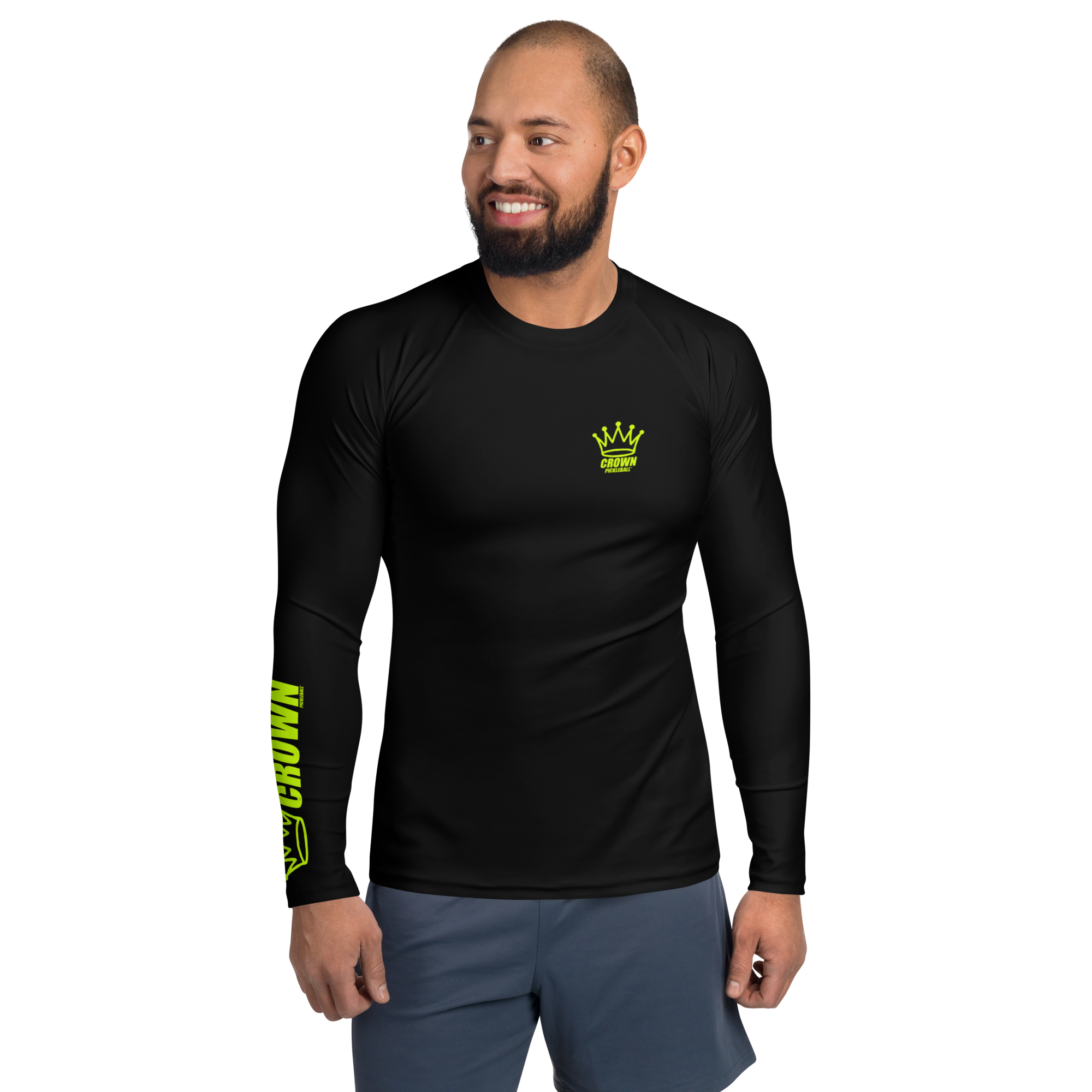 Man in black rash guard with lime green logos.