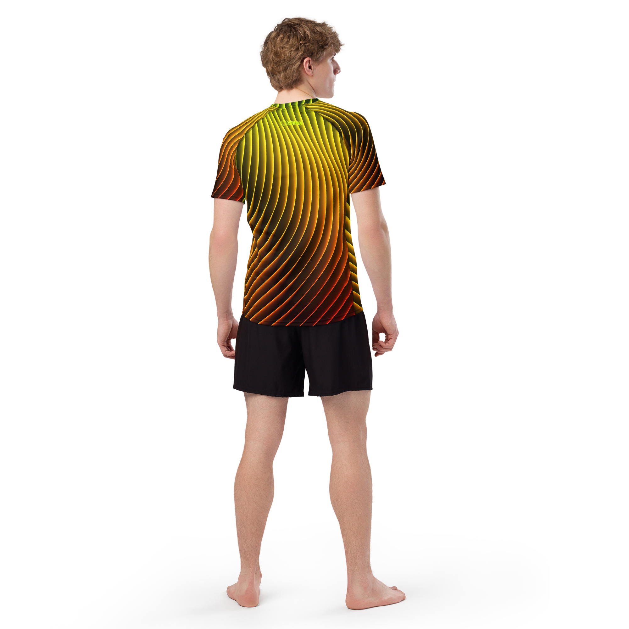 Man in black shorts and orange/yellow shirt standing facing away from camera.