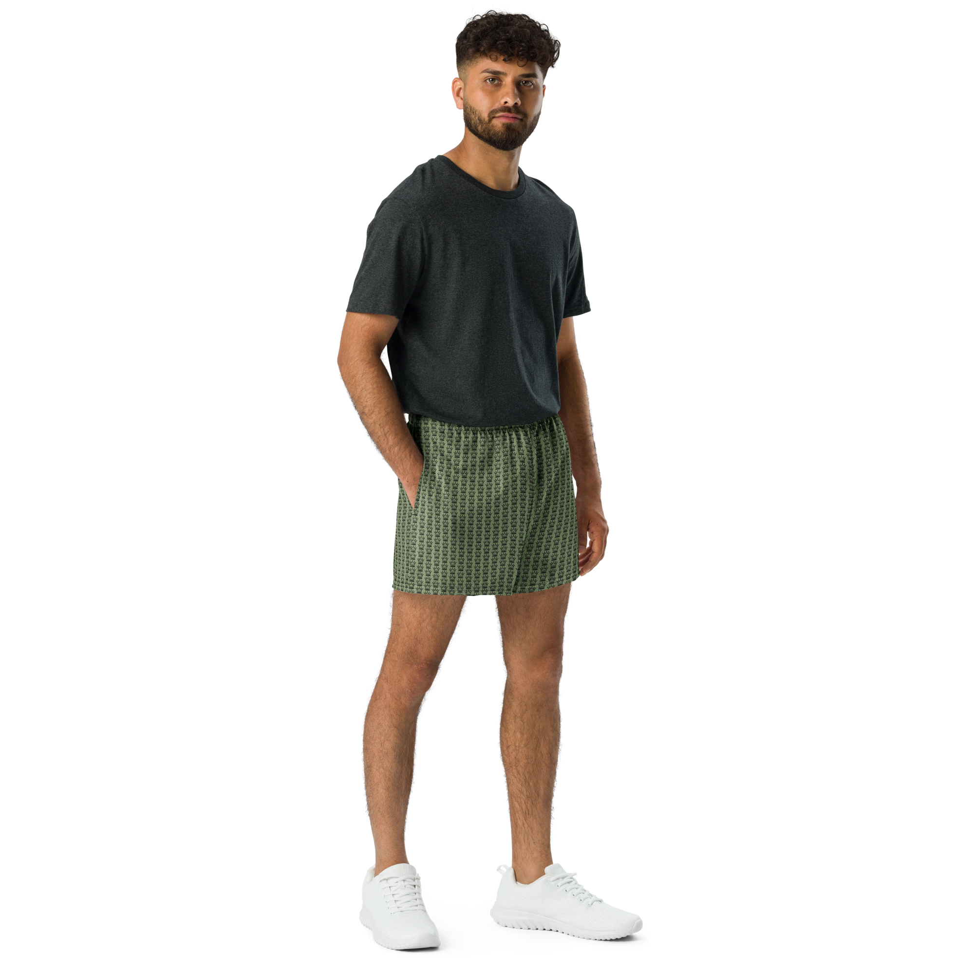 Man in t-shirt and patterned shorts with white sneakers.
